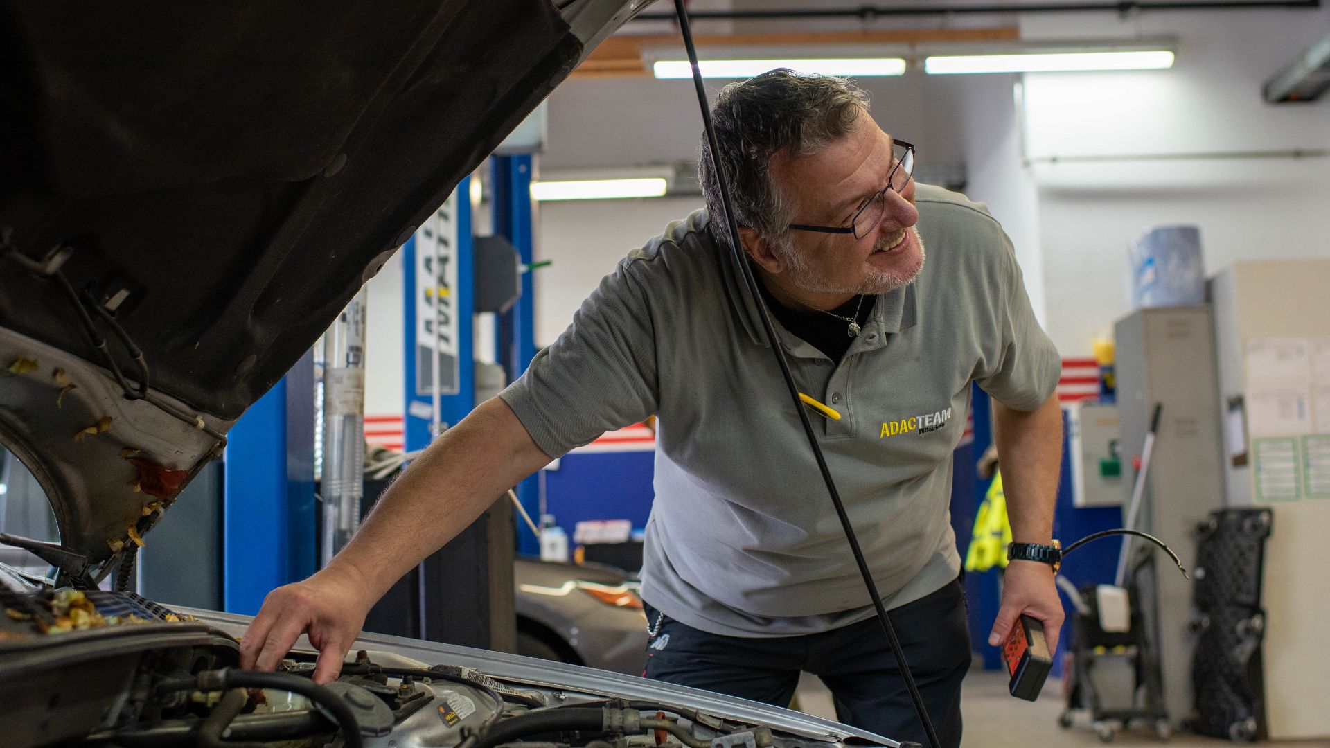 A vehicle safety representative checks the brake fluid of a vehicle during a winter vehicle inspection at Spangdahlem Air Base, Germany, Oct. 21, 2022. The inspections checked common issues that arise to ensure vehicles were safe to drive during the upcom