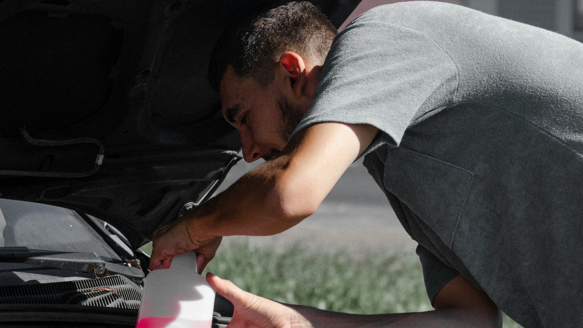 a man working on a car