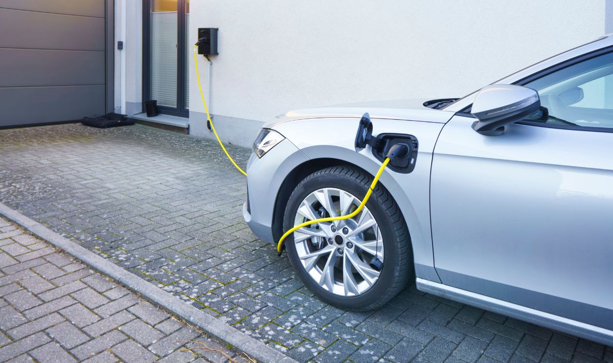 home ev charging from a wall box in the driveway