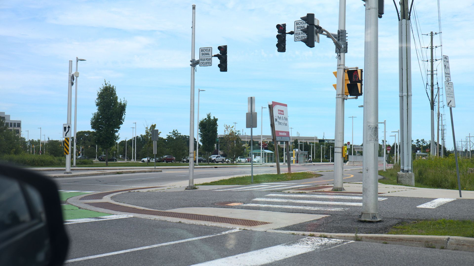 Protected intersection in the Ottawa suburb of Kanata, at the confluence of two bidirectional bike lanes next to the Innovation bus rapid transit station.