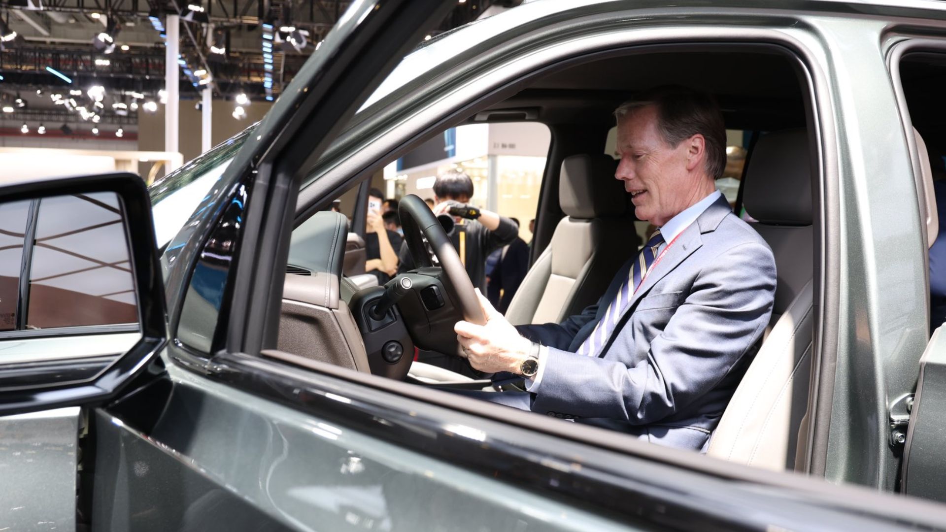 Ambassador Burns sits in driver seat of car