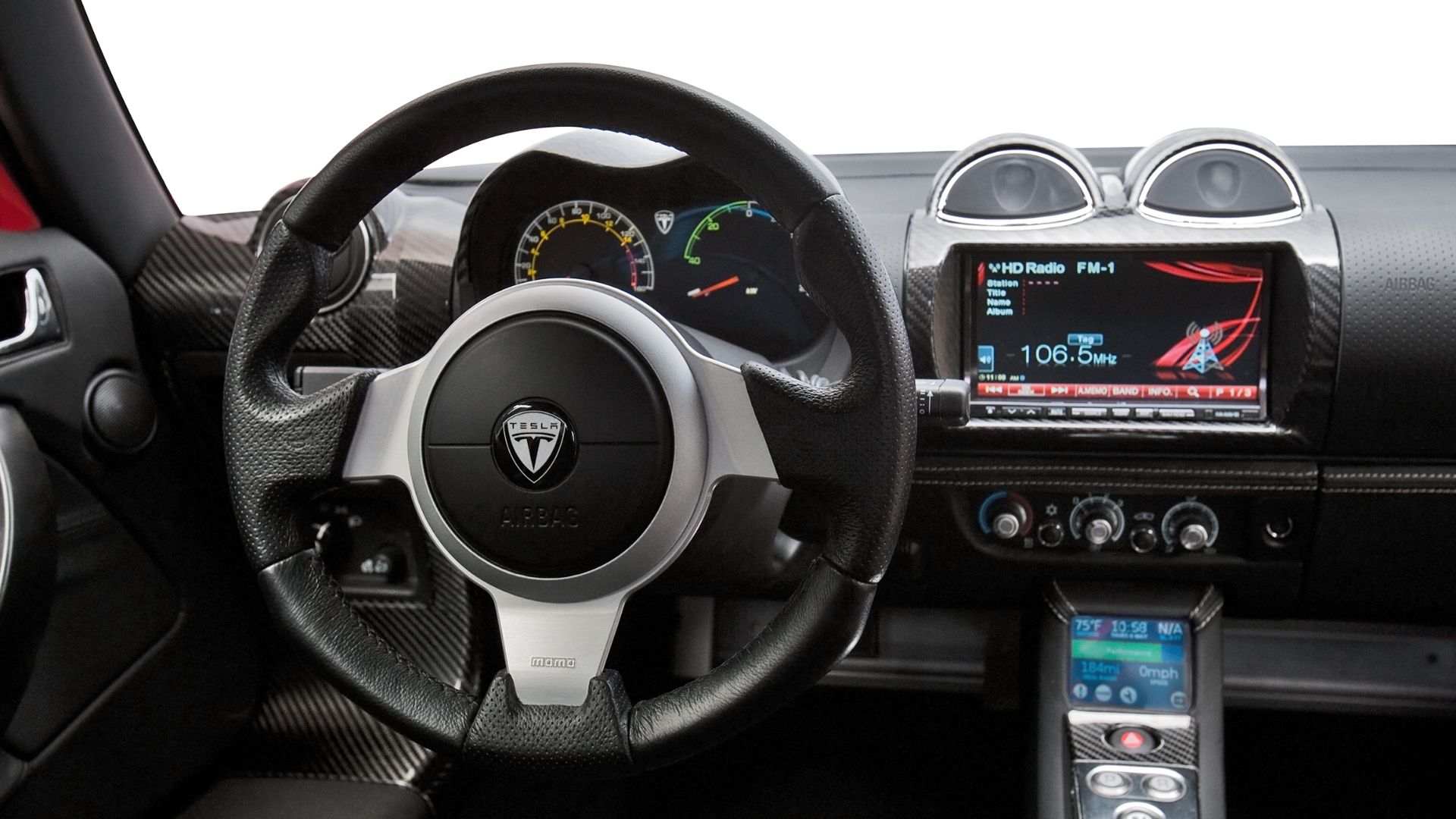 The Tesla Roadster 2.5, announced July 1, 2010, features an updated interior with a push-button gear-shifter in the center console, double-sized touchscreen, HVAC controls and other features. Tesla Roadster 2.5 interior
