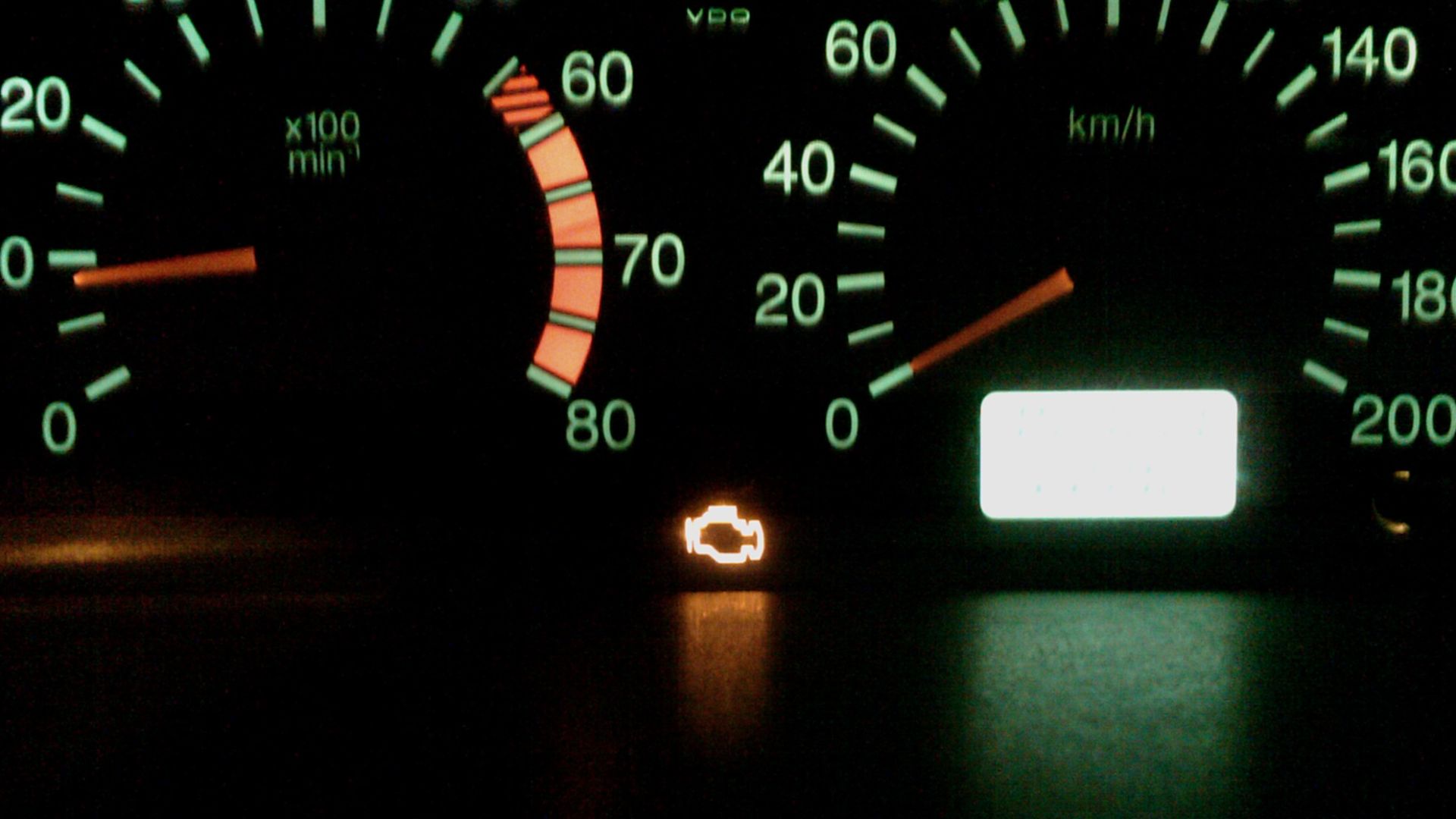 Check Engine lamp on a running engine indicating engine control system malfunction.