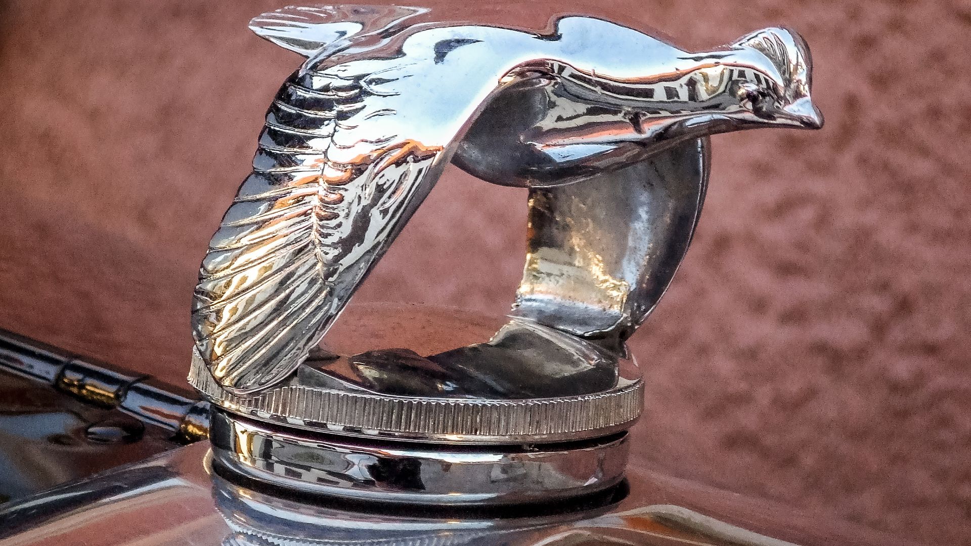 Quail hood ornaments on an old Ford parked in Sankt Hansgatan in Visby, Gotland, Sweden.