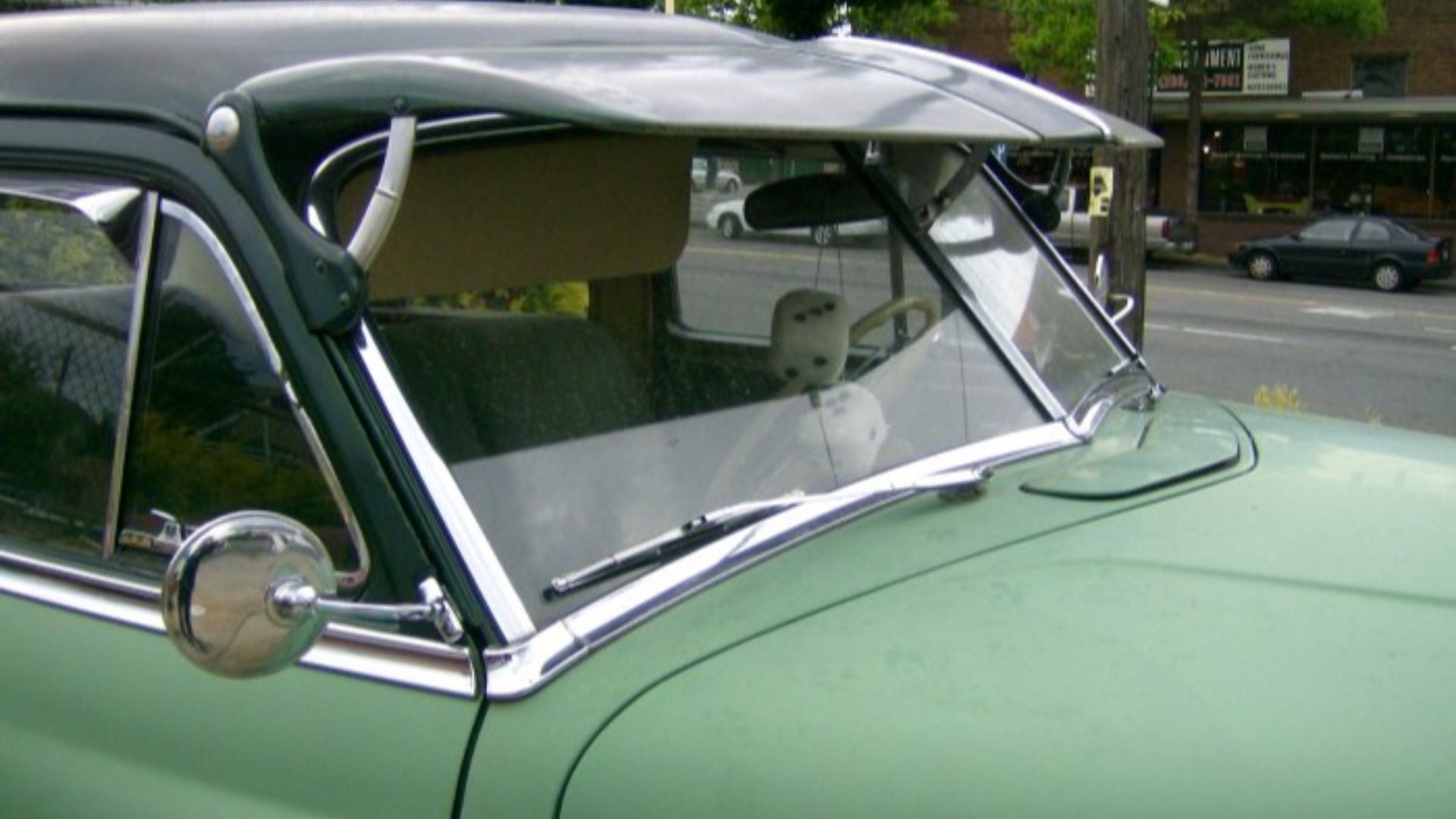 The split and raked windshield on a 1952 DeSoto DeLuxe. Shot by Sofar No. 2 at the corner of 24th Ave. and Market St. in Seattle, Washington, on June 3rd, 2007. Intended for use in the