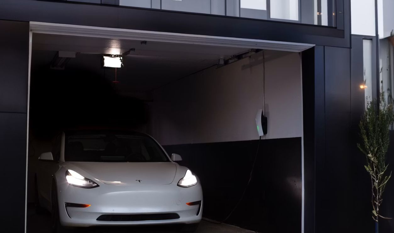 a white car is parked in a garage