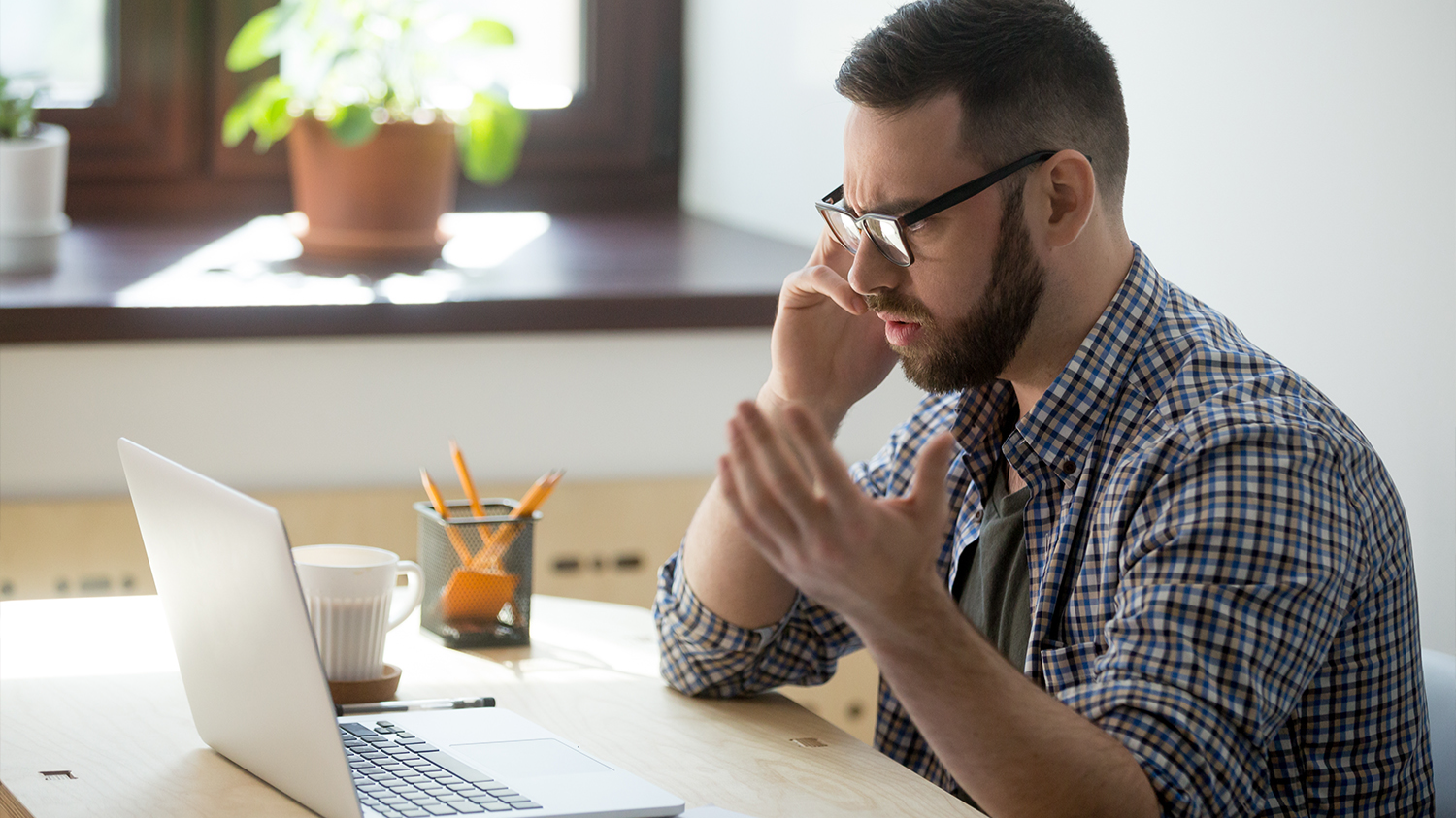 Confused Man Looking At His Computer