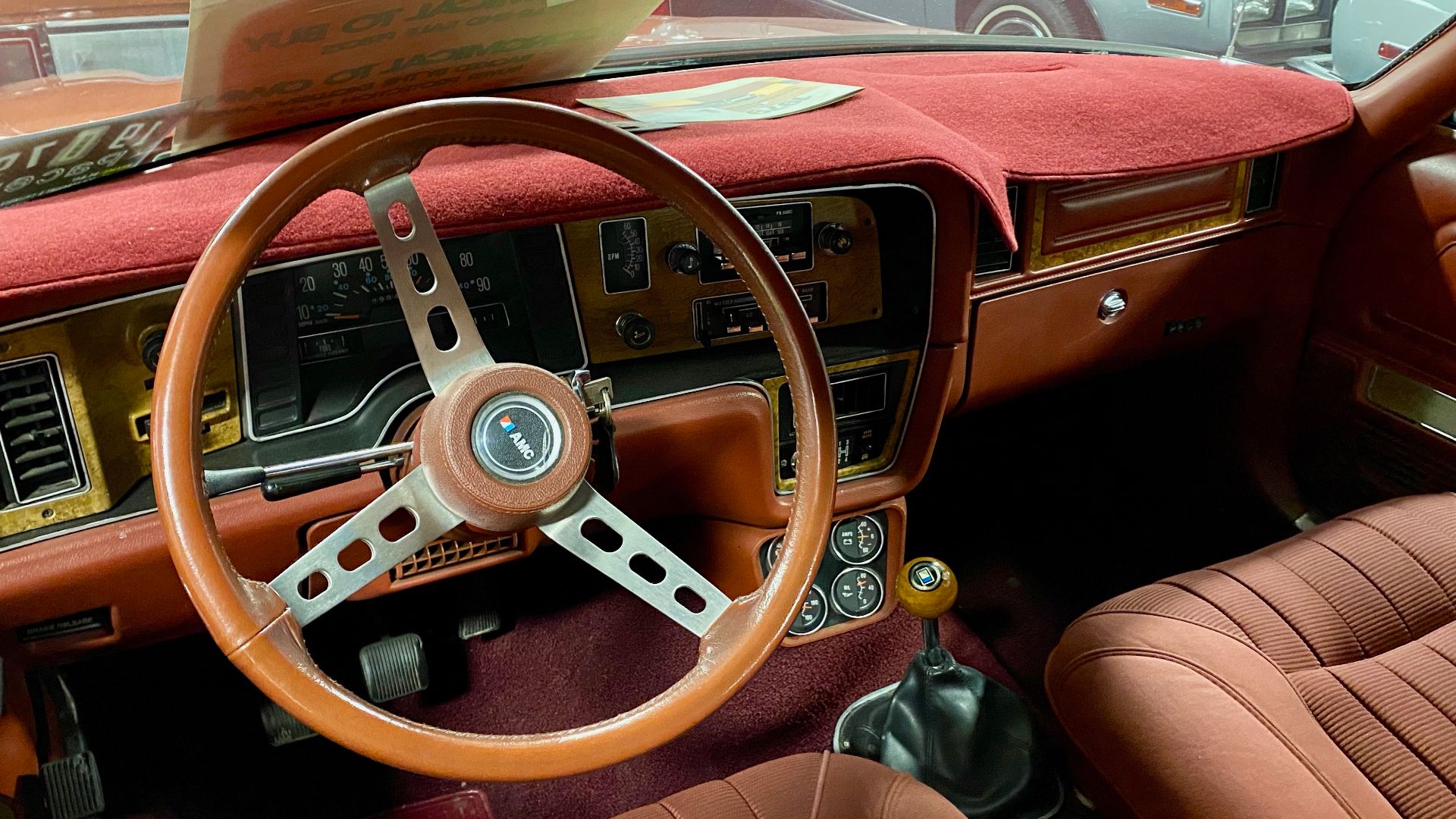 1978 AMC Pacer DL station wagon. A compact car built by American Motors Corporation. This D/L wagon has the available two-tone exterior paint in Russet and Bordeaux metallic on the upper and lower body sides as well on the rear liftgate. It also has AMC's