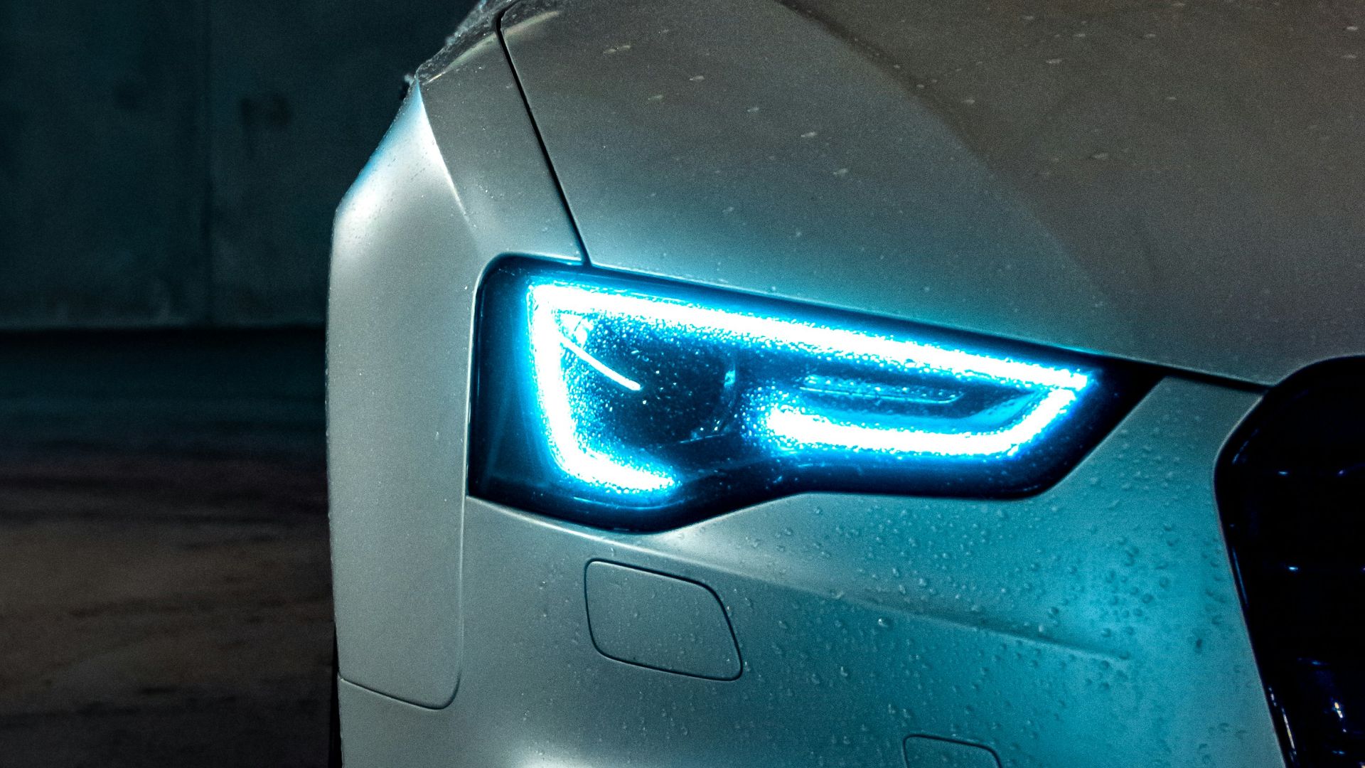 white vehicle with blue neon headlight bulb