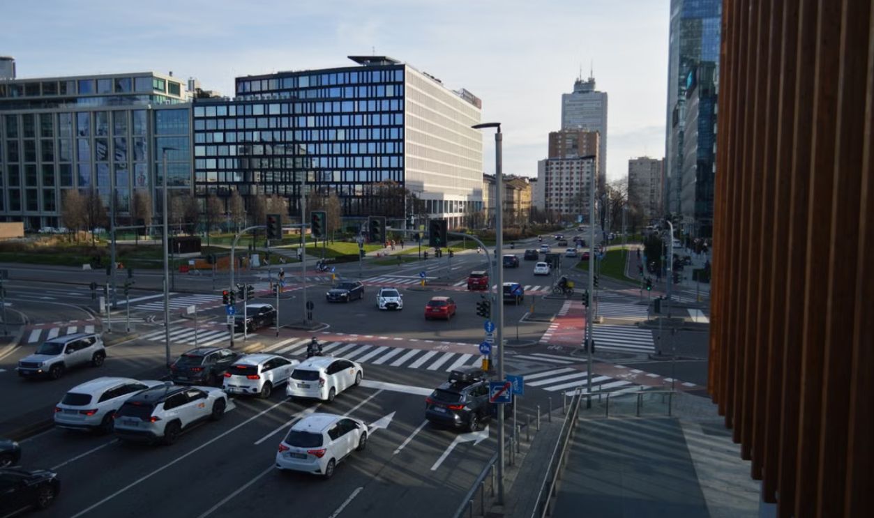 Urban cityscape featuring a bustling intersection surrounded by modern architecture.