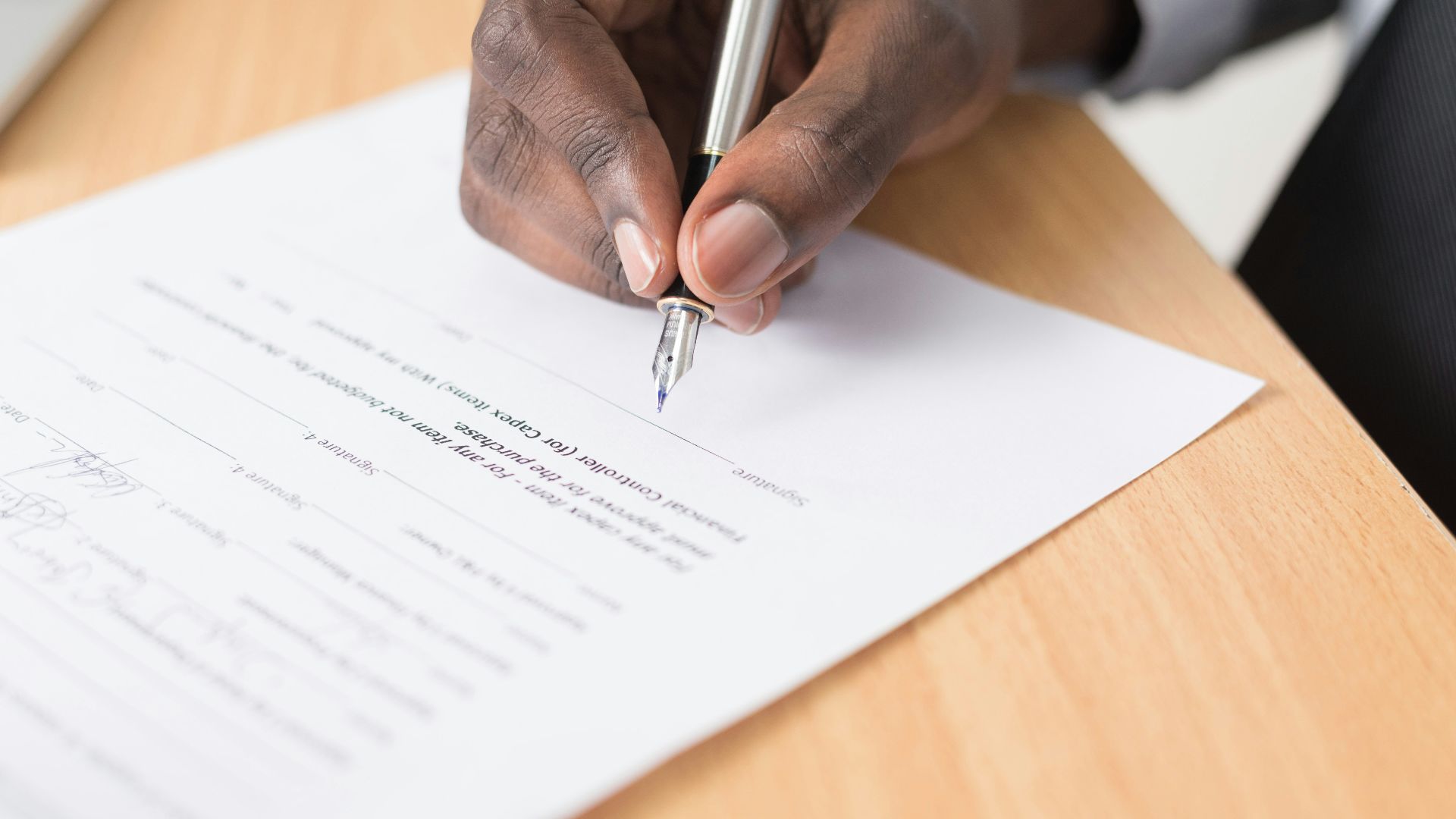 person writing on white paper