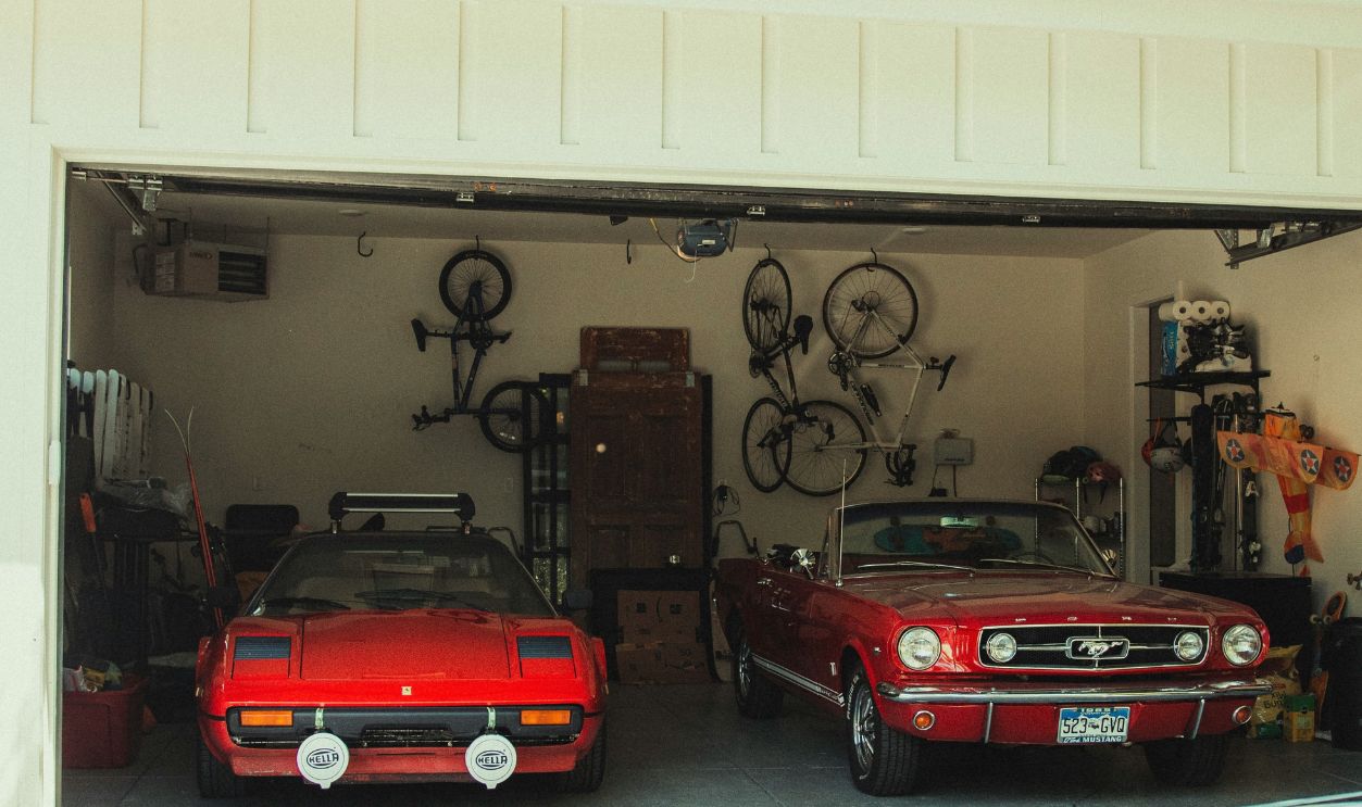 red and black car parked in garage