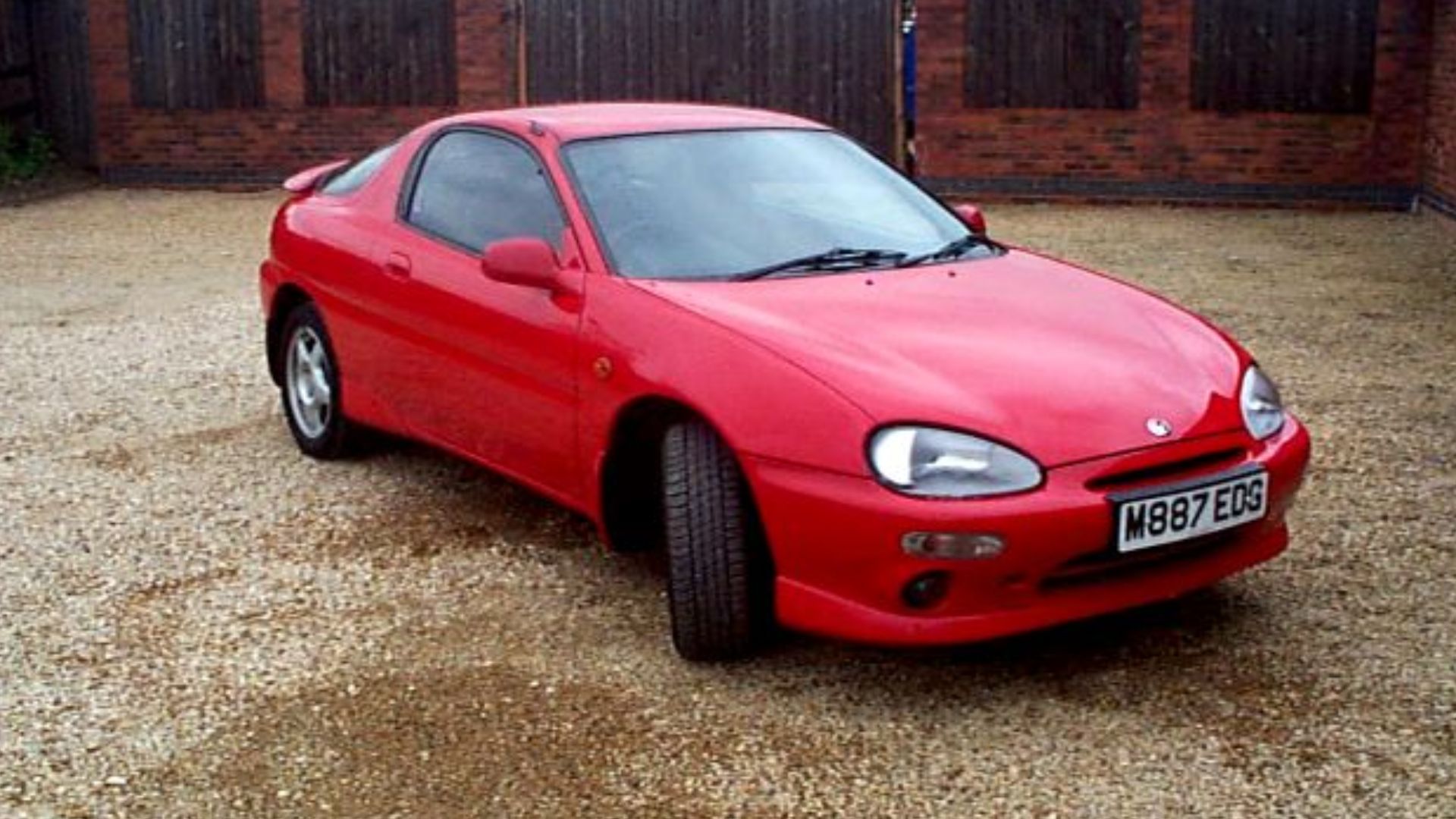 Side view of a UK specification 1995 Maxda MX-3.