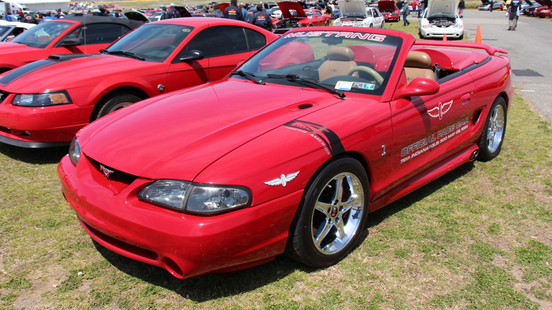 Vibrant Red. 
An all new 4th generation Mustang, the SN-95, was introduced in 1994, the notchback and hatchback were gone, replaced by a swoopier style coupe, a convertible was also available. The 1999 facelift saw a tougher look with sharper contours. Th
