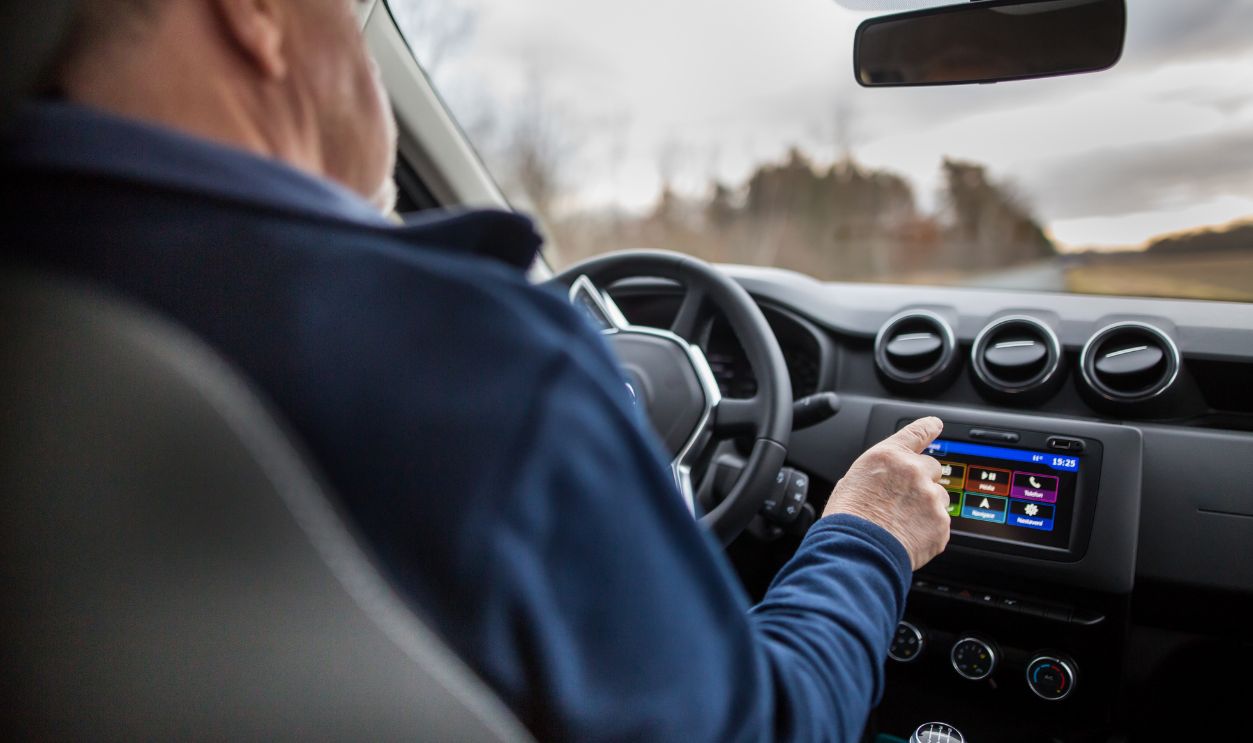 Man using GPS navigation while riding a car, transportation concept