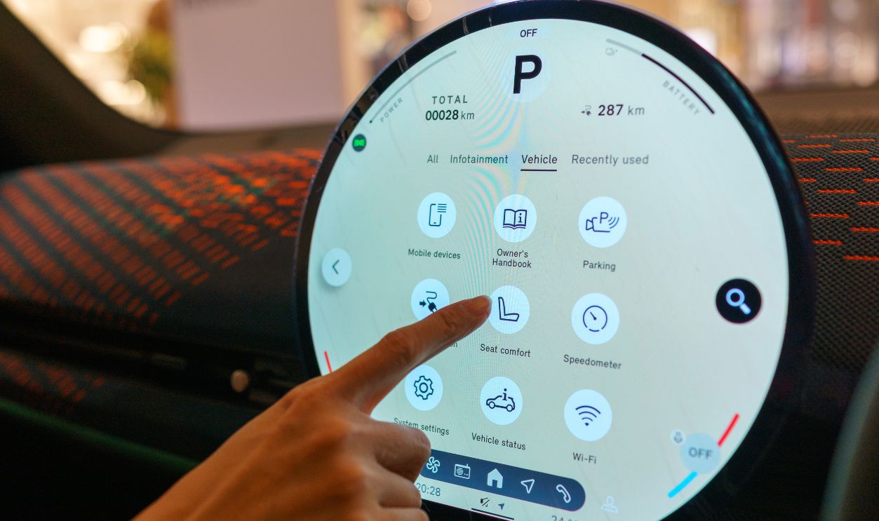 Penang, Malaysia – May 9, 2025: A user interacts with the touchscreen in the all-electric MINI Aceman, accessing the vehicle settings interface, including seat comfort and parking assistance.