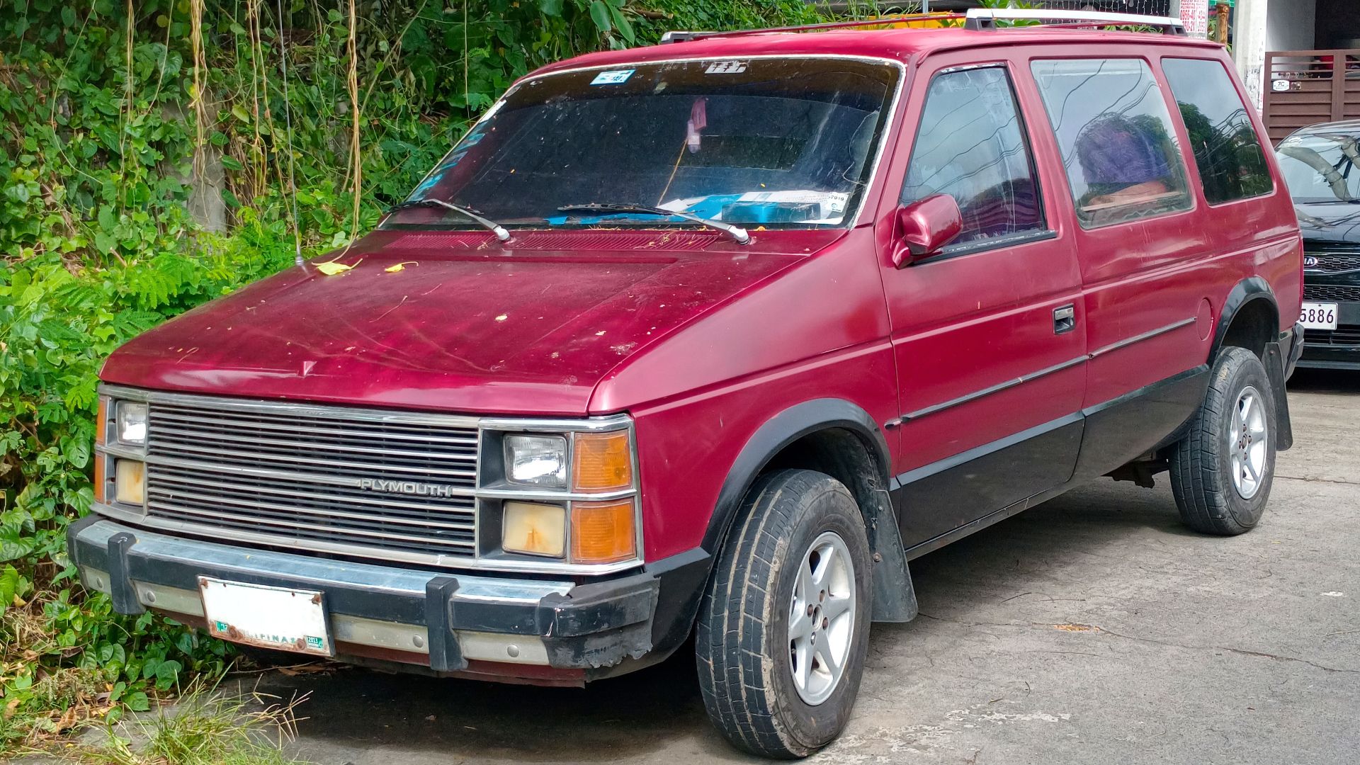 1984-86 Plymouth Voyager LE in Garnet Red Pearl Coat. One of the remaining few examples of surviving Plymouth vehicles in the Philippines.