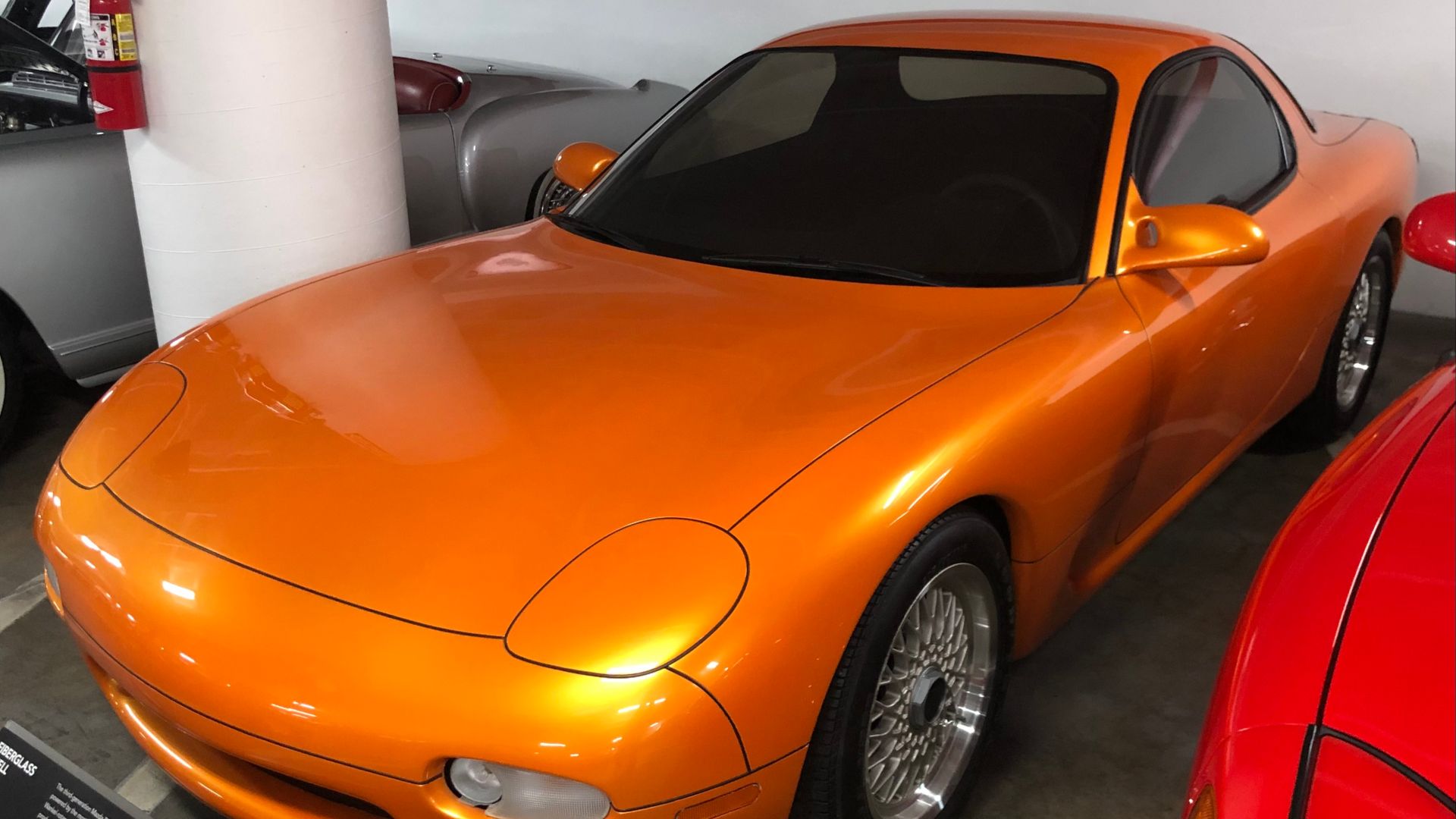 From the plaque at the museum, this is the concept version of the winning design for the FD RX7, and is a fiberglass shell with no interior