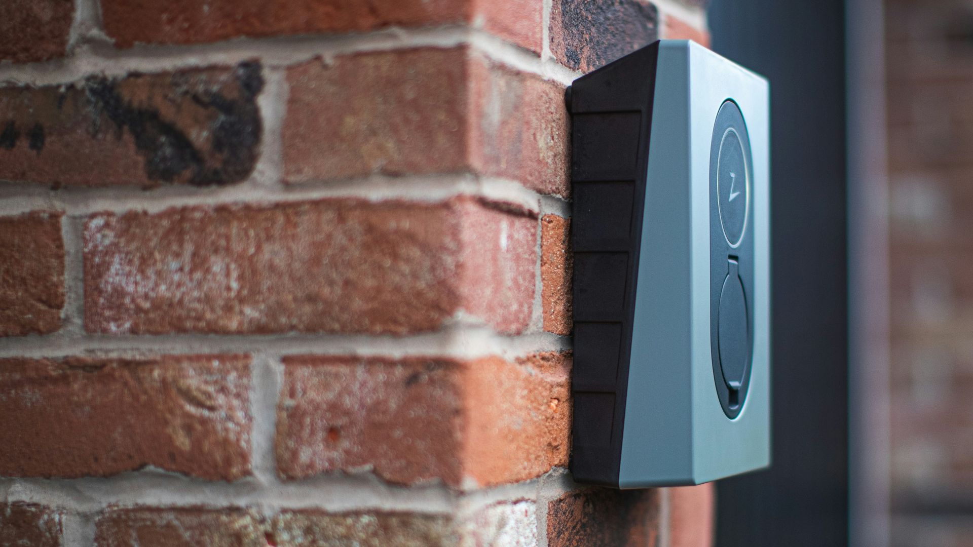 a close up of a brick wall with a speaker on it