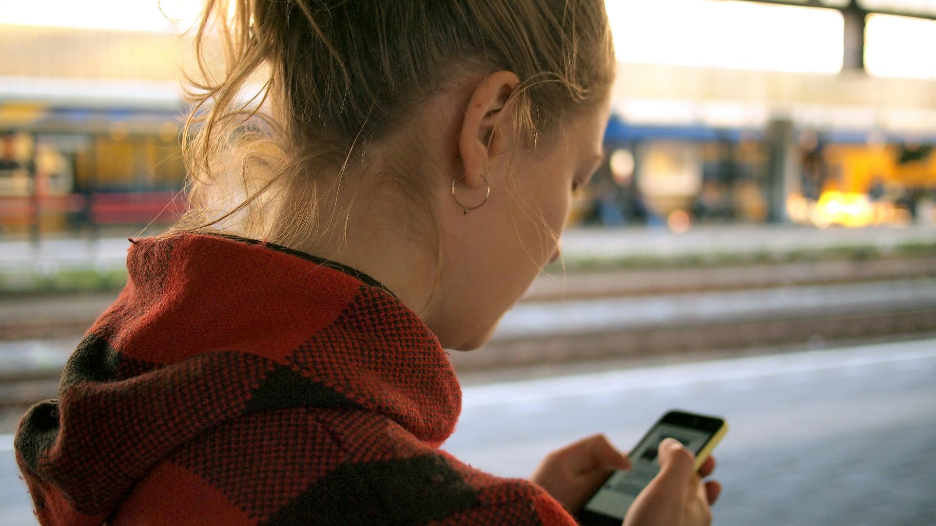 woman holding phone