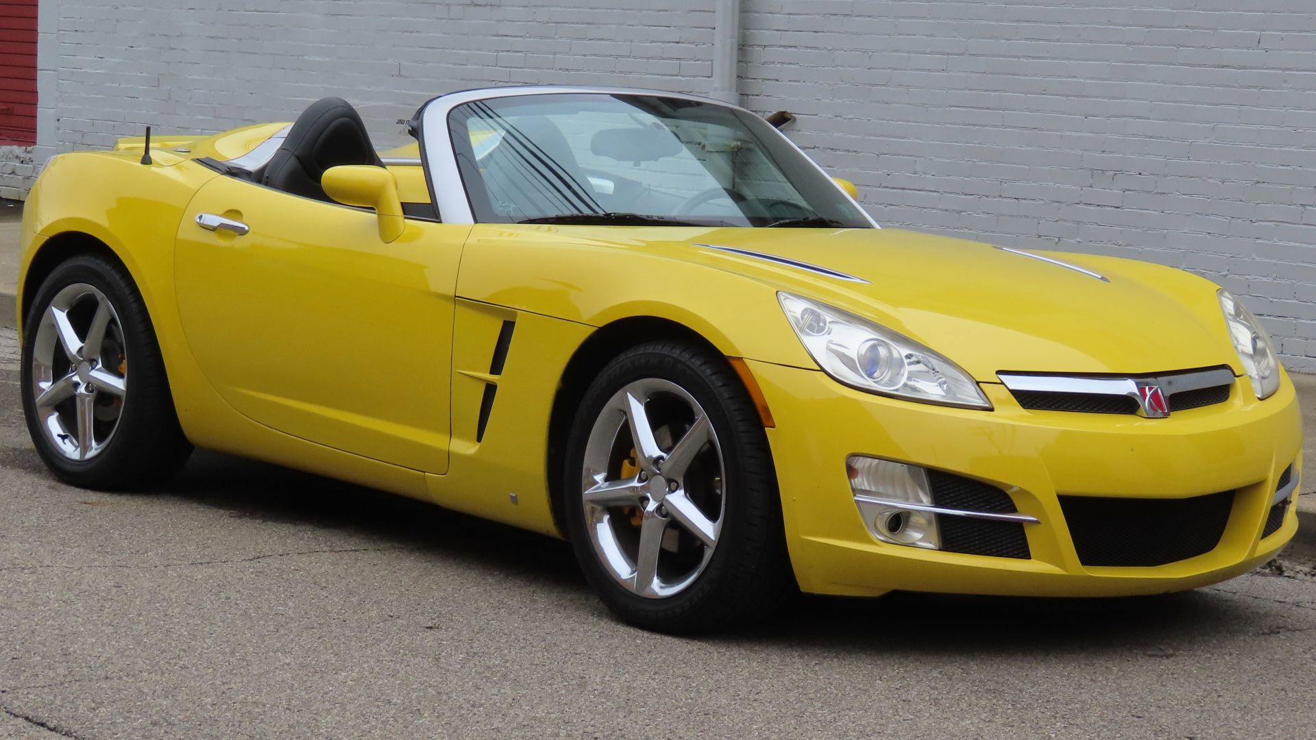 2007 Saturn Sky photographed in New Brighton, Pennsylvania. Finished in Sunburst Yellow.