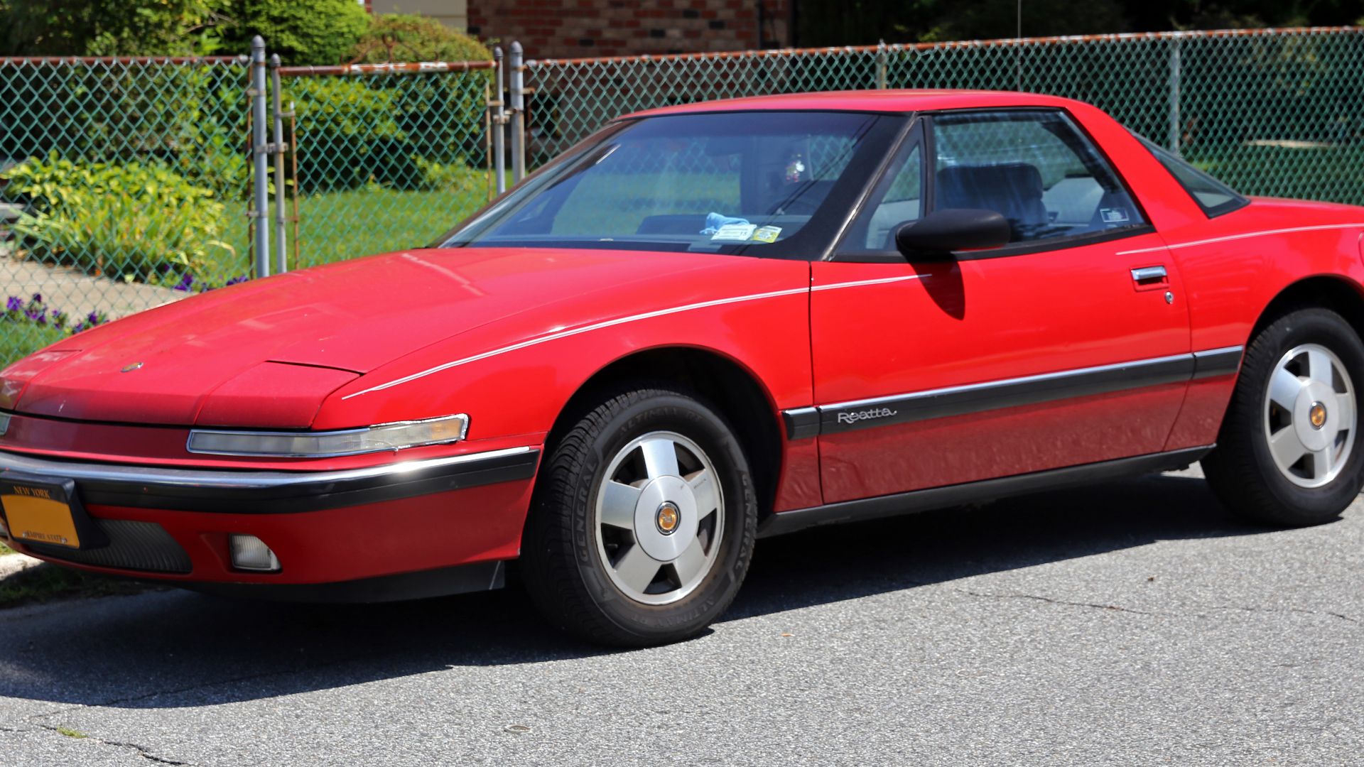 A 1988 Buick Reatta. 4-spd auto and 3.8 litre V6, as per all Reattas.