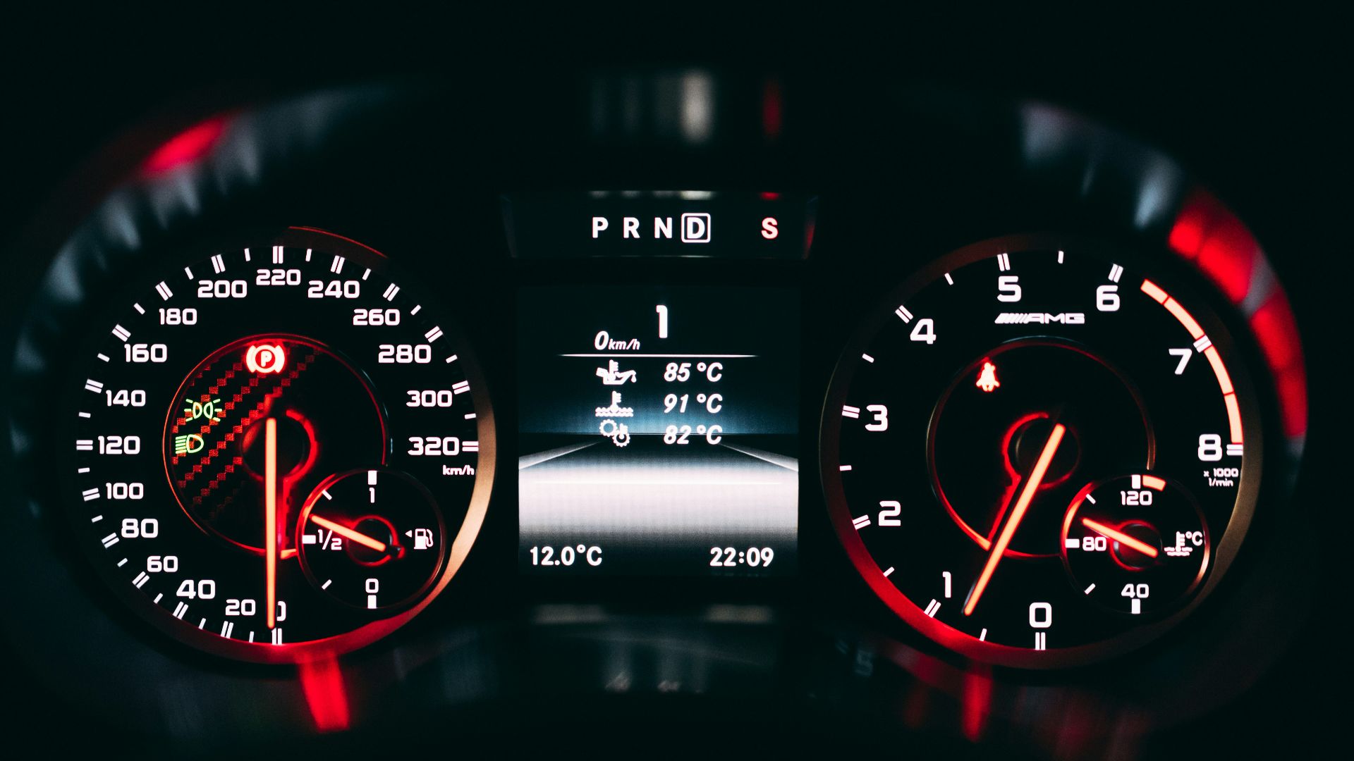black and red analog speedometer