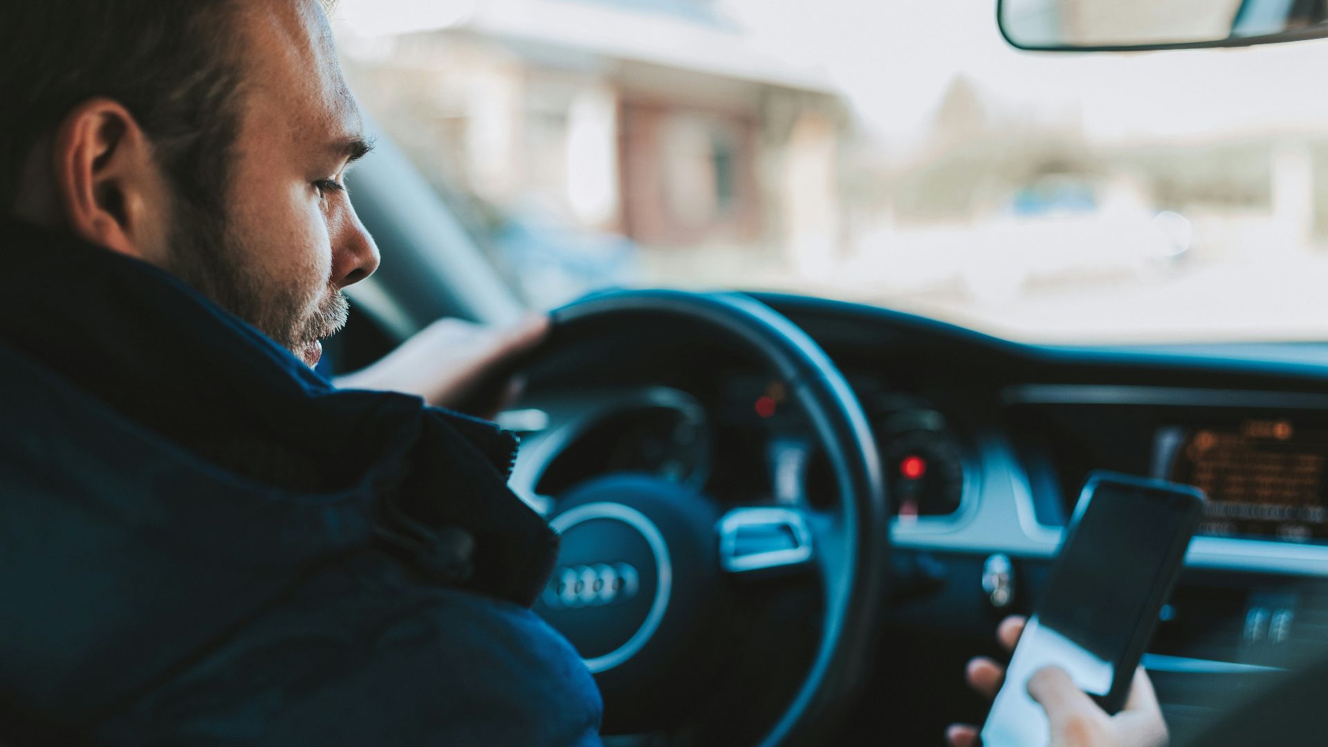 man holding black smartphone