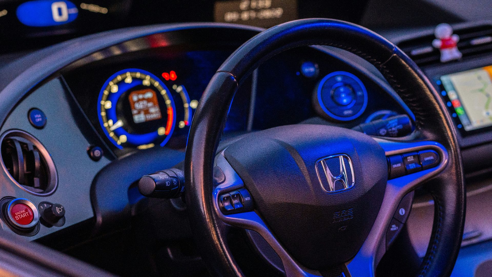 a steering wheel and dashboard of a car