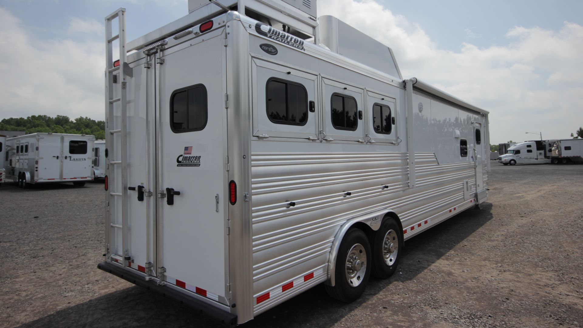 Cimarron 3-horse Slant Load Horse Trailer with Living Quarters
This 3-horse slant load living quarters horse trailer from Cimarron features dual 8,000 lb. Dexter Torflex Axles with 8-bolts hubs, electric/hydraulic brakes, dual electric/hydraulic brakes wi
