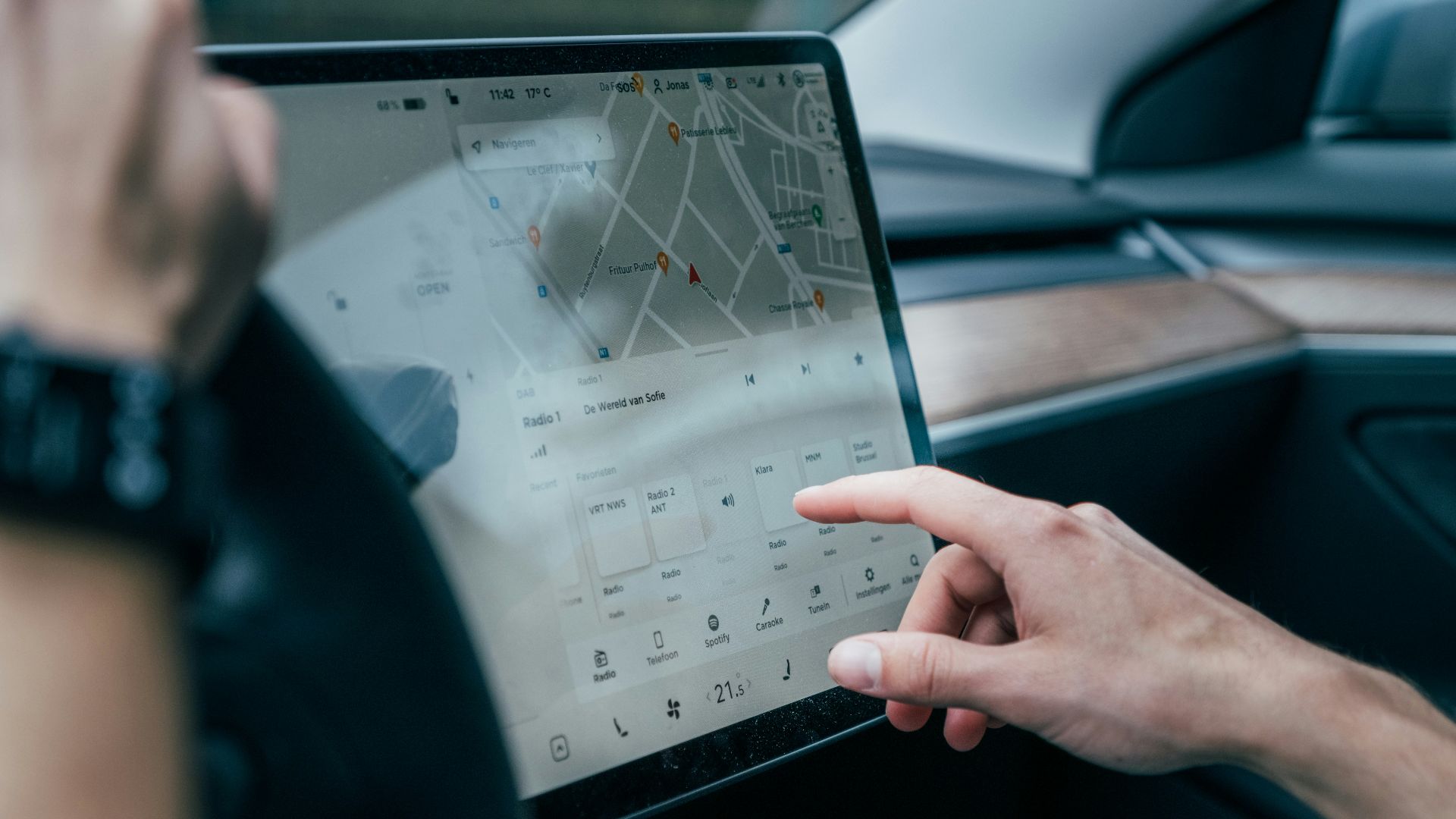 a person using a laptop in a car