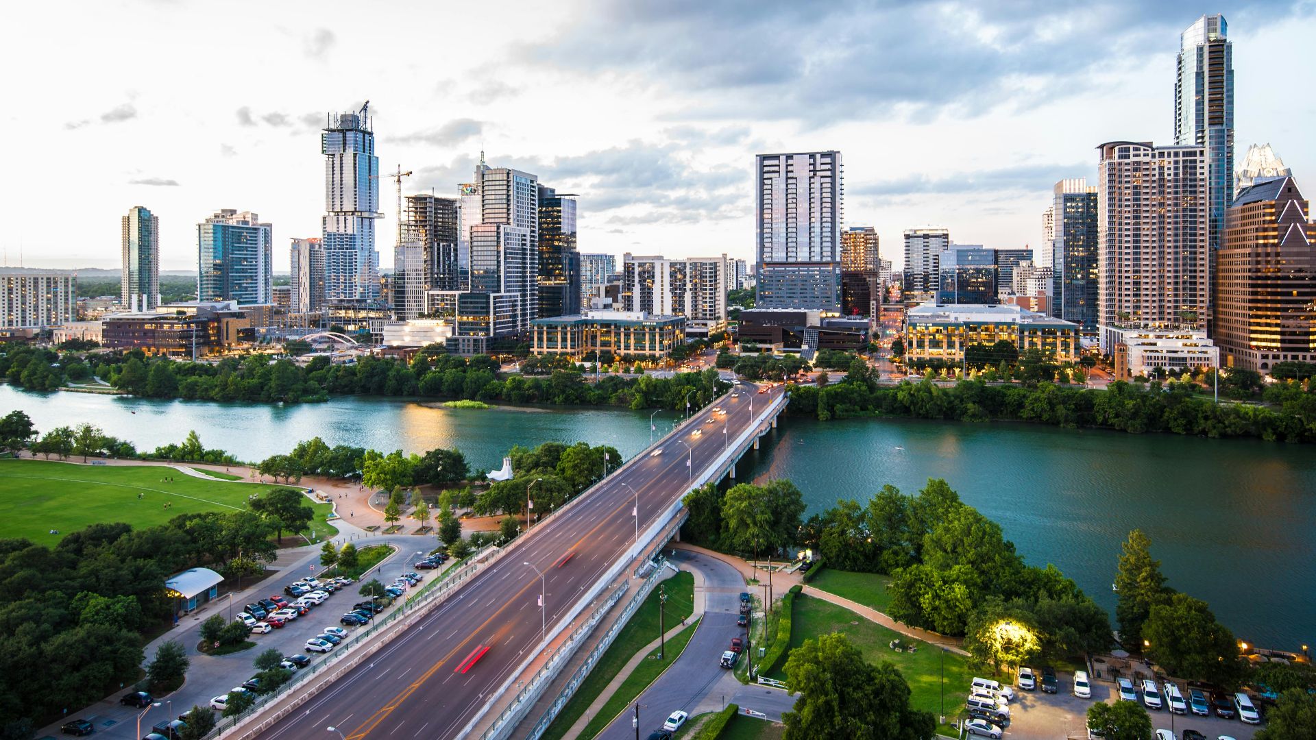 An aerial view of the Austin skyline and Congress Avenue Bridge over Lady Bird Lake