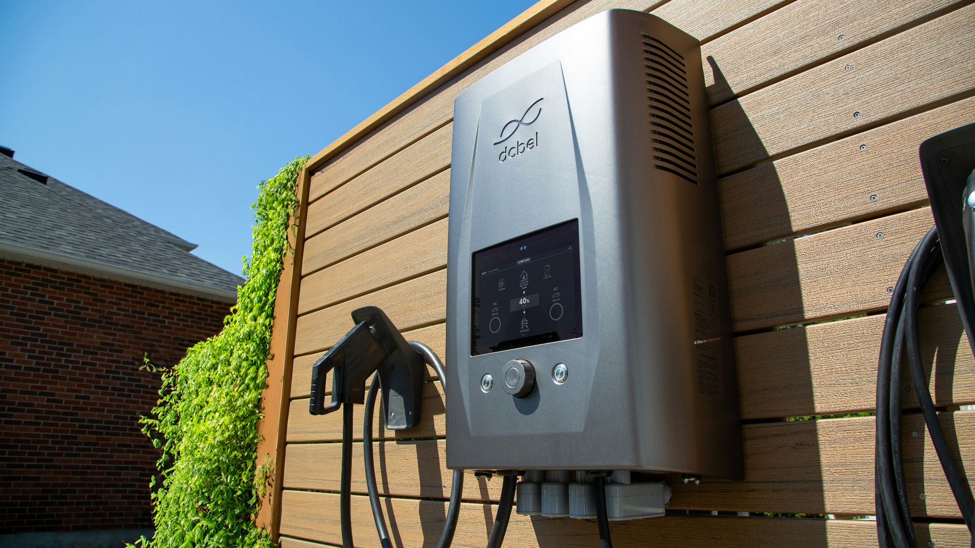 Electric car charger mounted on a wooden wall