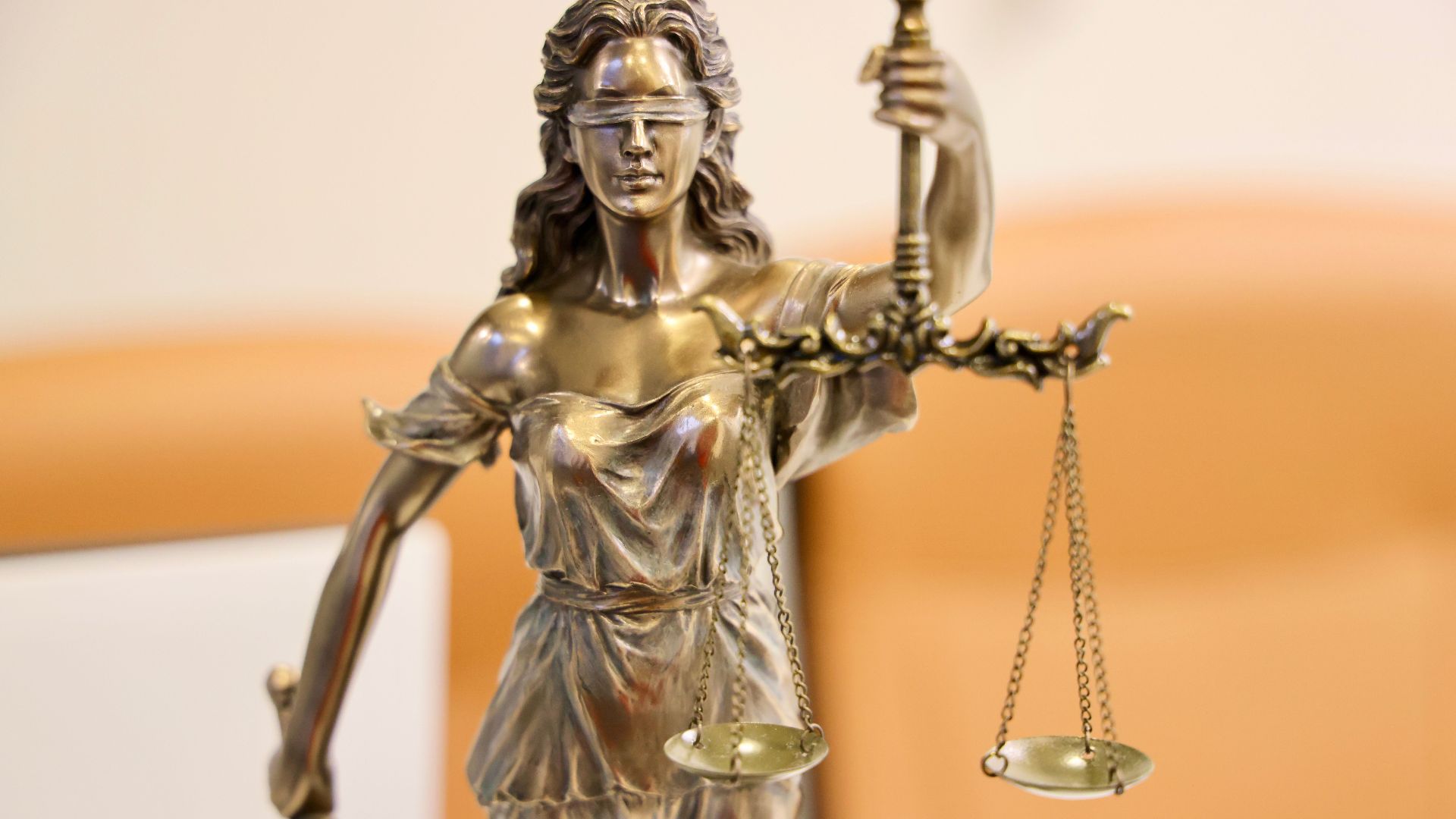 Detailed image of Lady Justice statue, symbolizing fairness and impartiality.