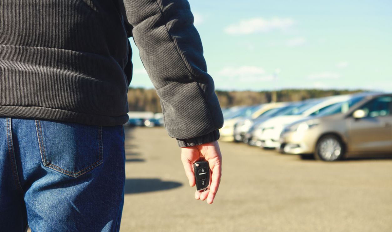 man walking on the car market choosing car to buy