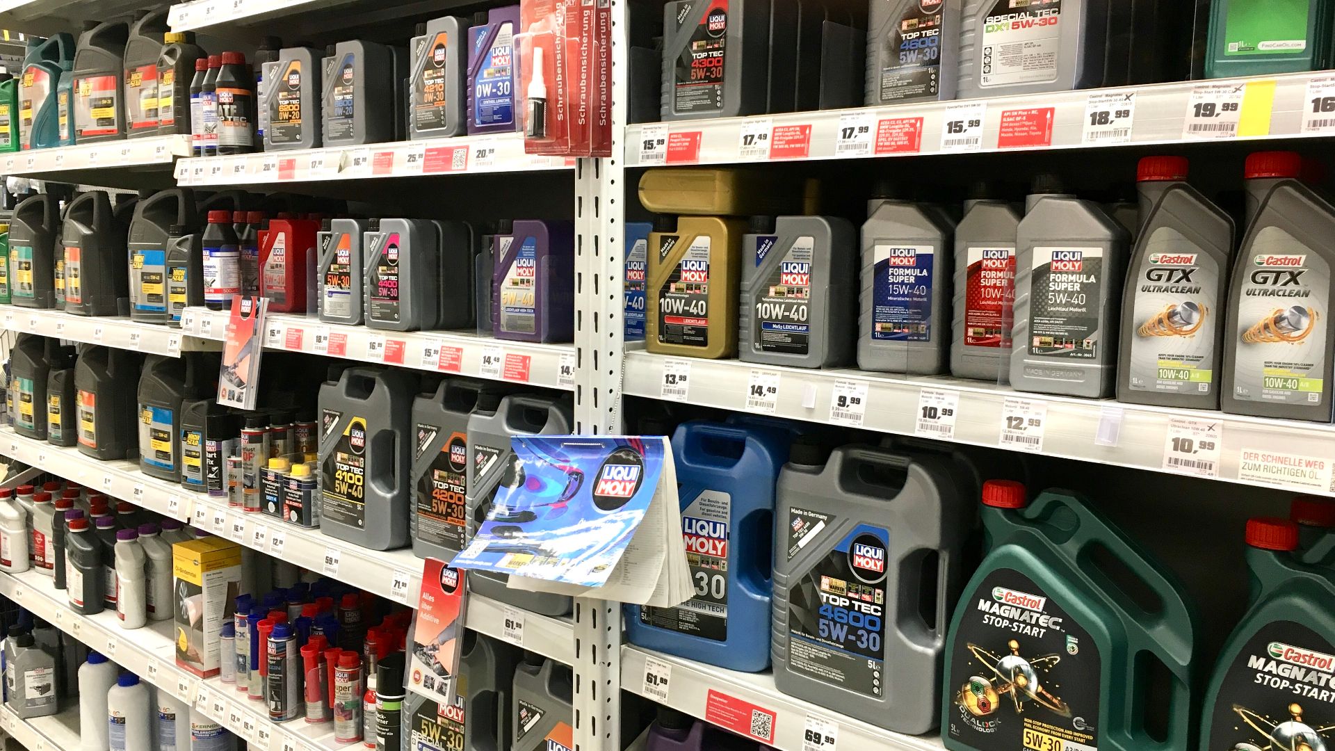 Motor oil for cars and motorcycles from various producers in German hardware store