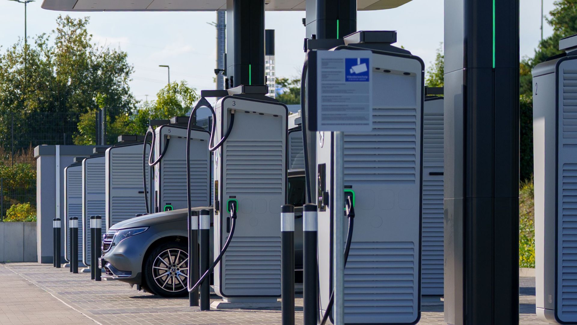 Contemporary outdoor electric vehicle charging station with sleek design and innovative technology for clean energy.