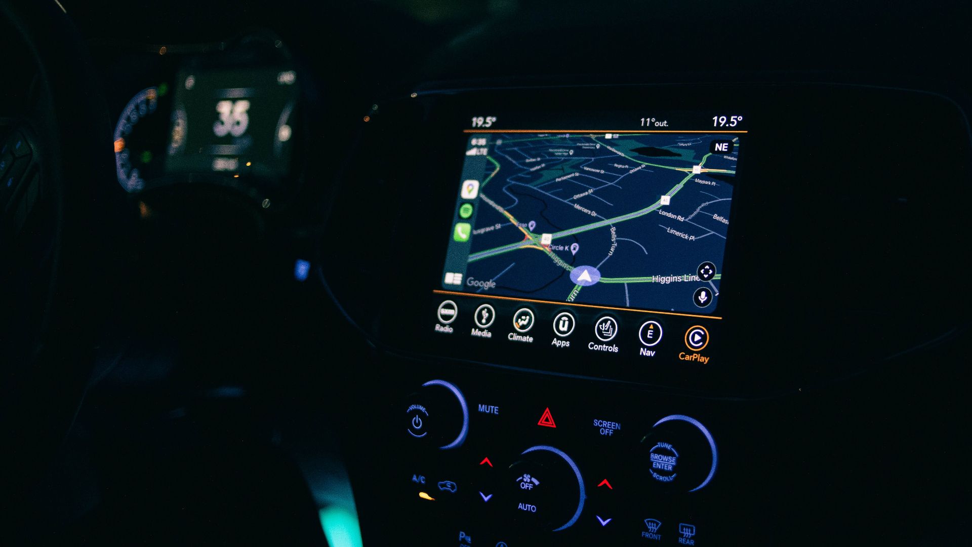 Interior view of a car featuring the GPS navigation system illuminated at night, showcasing technology and modern travel.