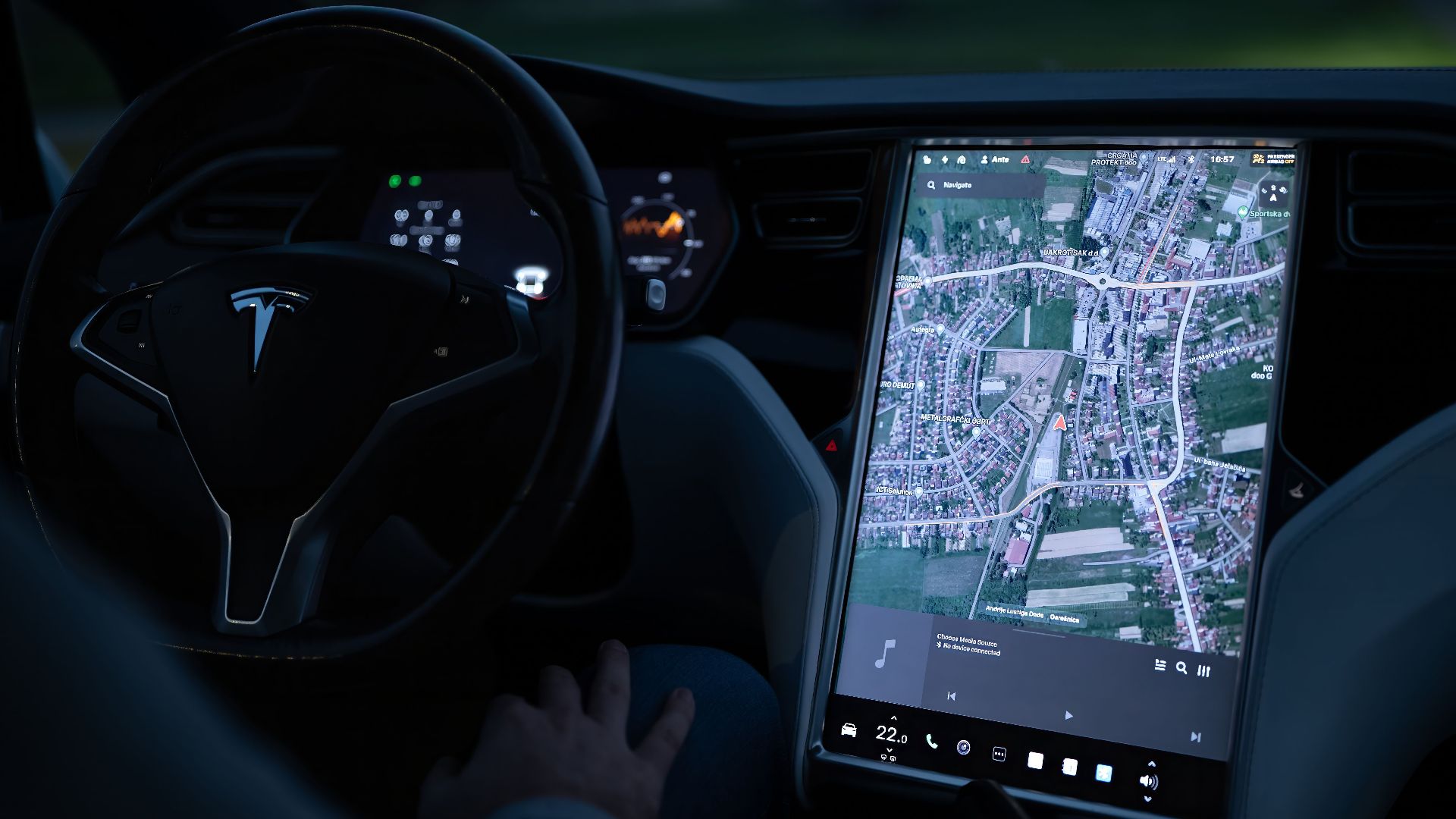 Explore the advanced touchscreen navigation in a modern electric vehicle's sleek interior at night.