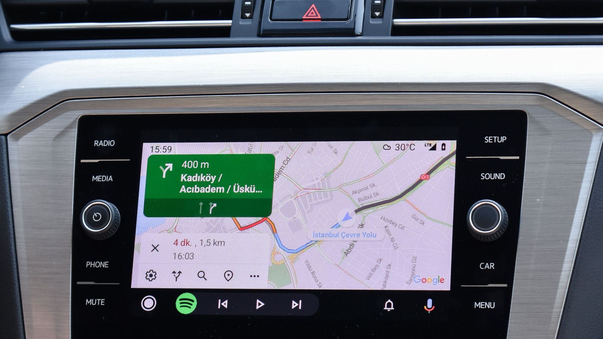 Close-up of a car GPS navigation system inside a Volkswagen Passat dashboard.