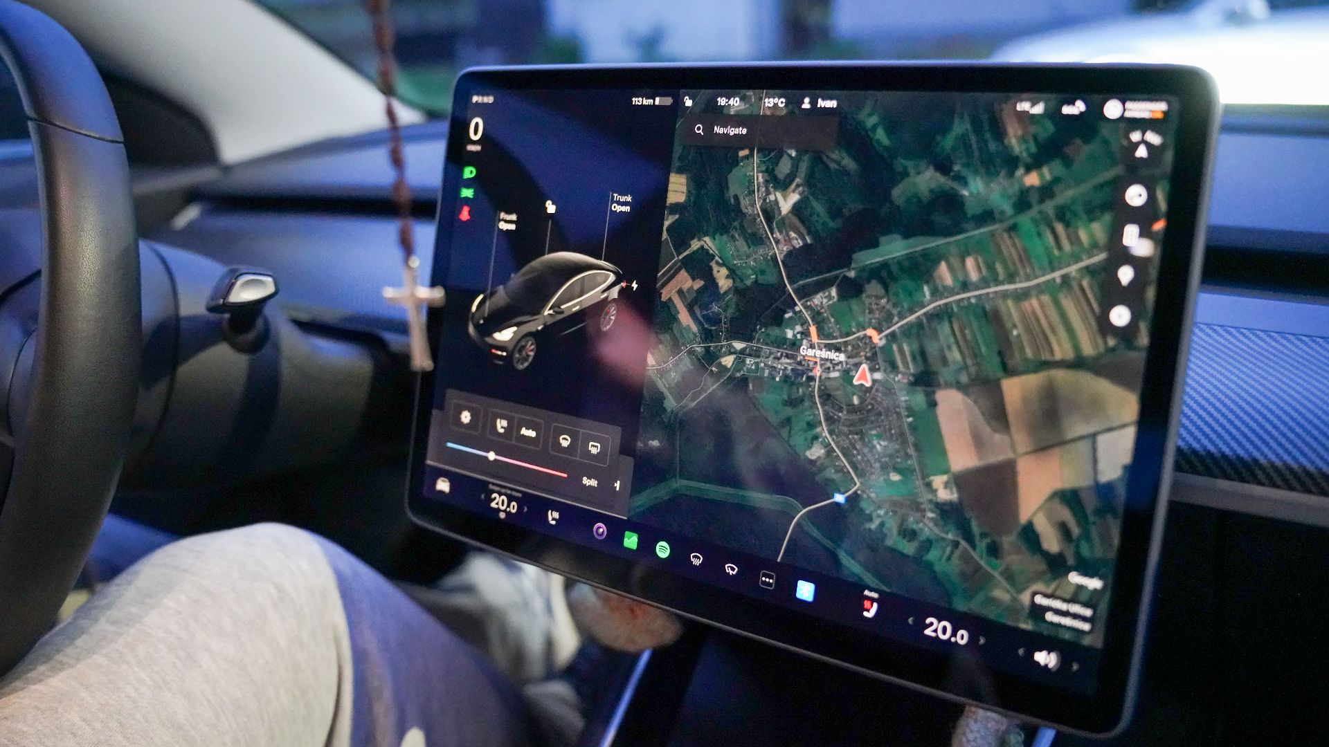 Close-up of a car's digital dashboard displaying GPS navigation in Garešnica, Croatia.