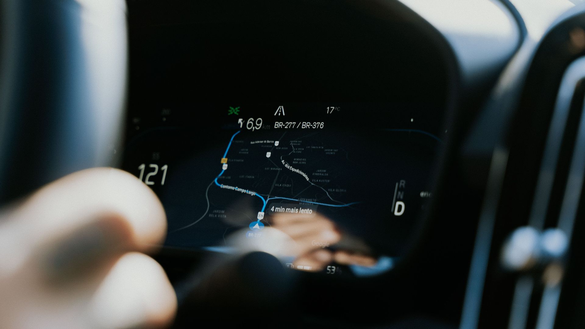 Close-up view of a car dashboard showing a GPS navigation screen in use.