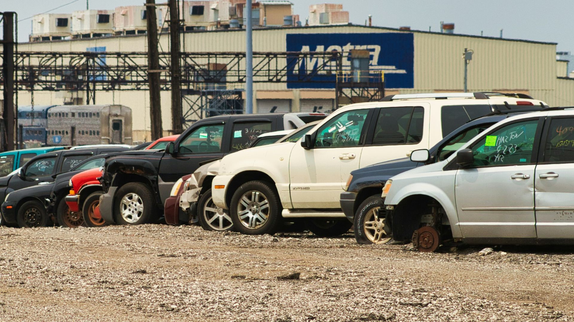 a parking lot filled with lots of parked cars
