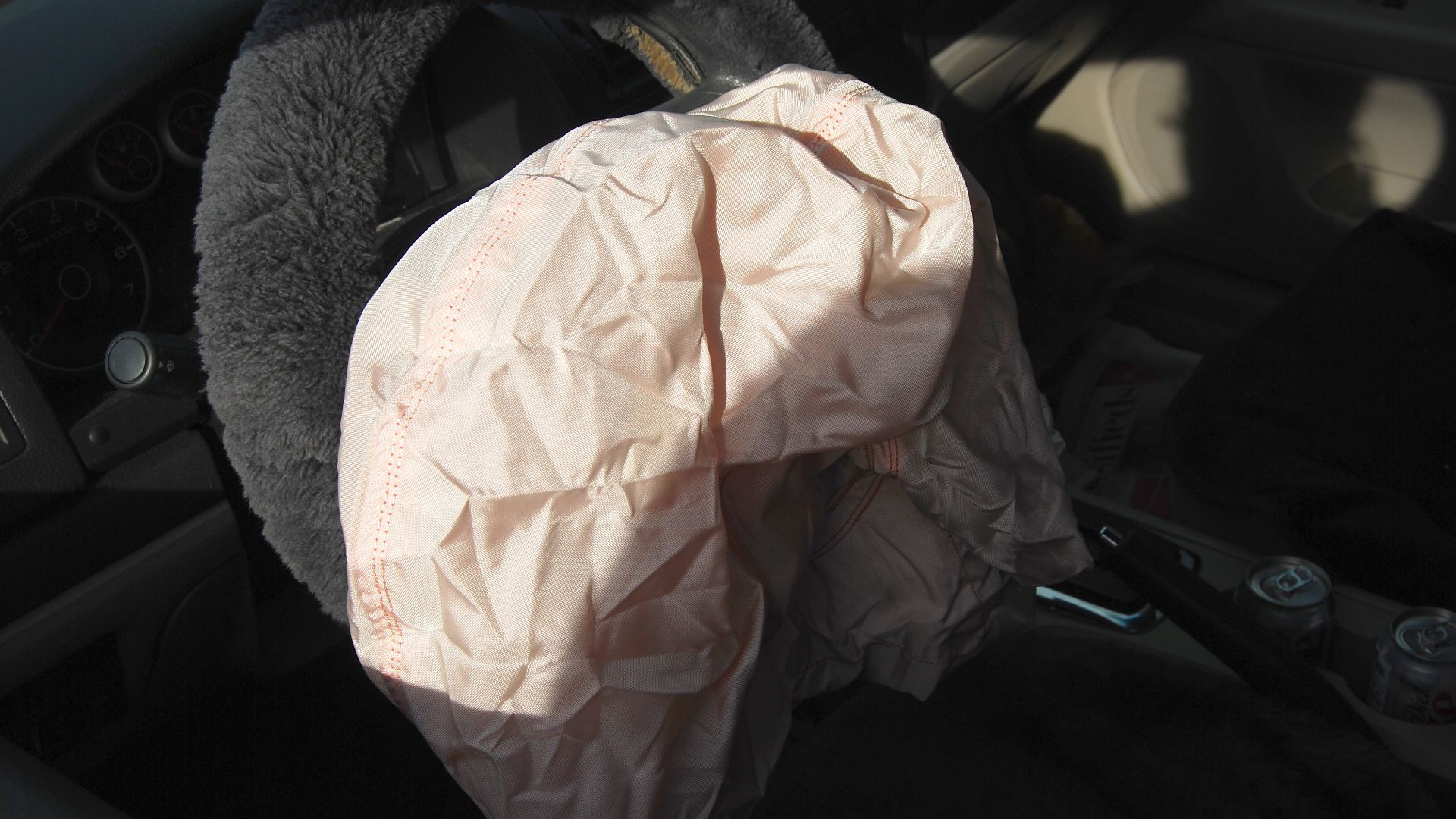 A deployed airbag following a car accident.