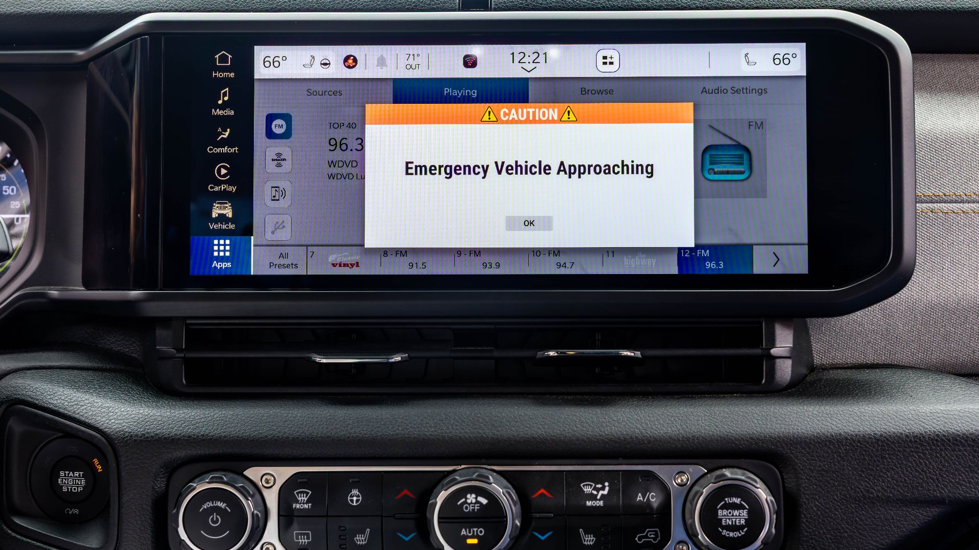 A HAAS Alert message from an approaching emergency vehicle is displayed on the infotainment screen of a Jeep Wrangler during a technology demonstration in Detroit in 2025