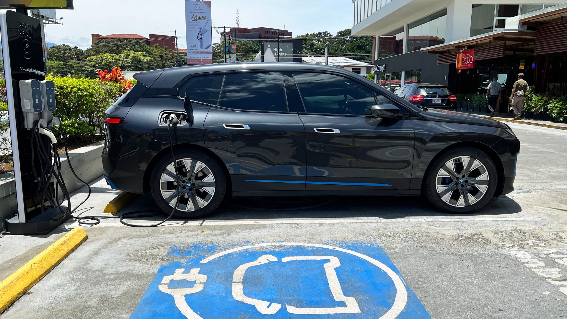 BMW iX charging at Level 2 public charger in a shopping center, Escazú, San José, Costa Rica