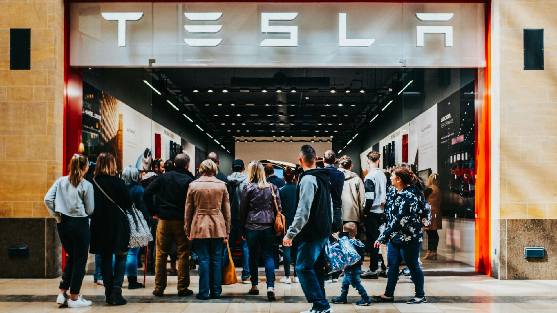 a group of people standing outside of a building