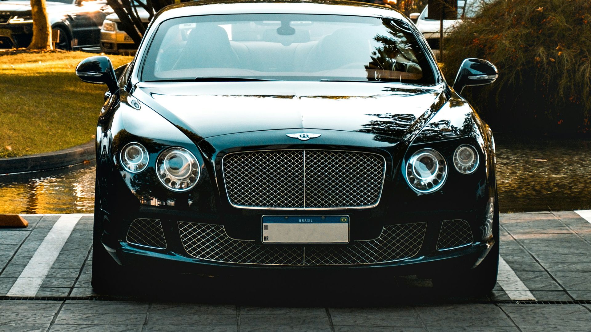 a black car parked in a parking lot