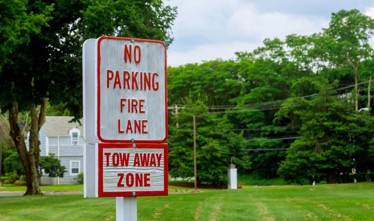 Fire lane - no parking sign Red Letters on White Sign