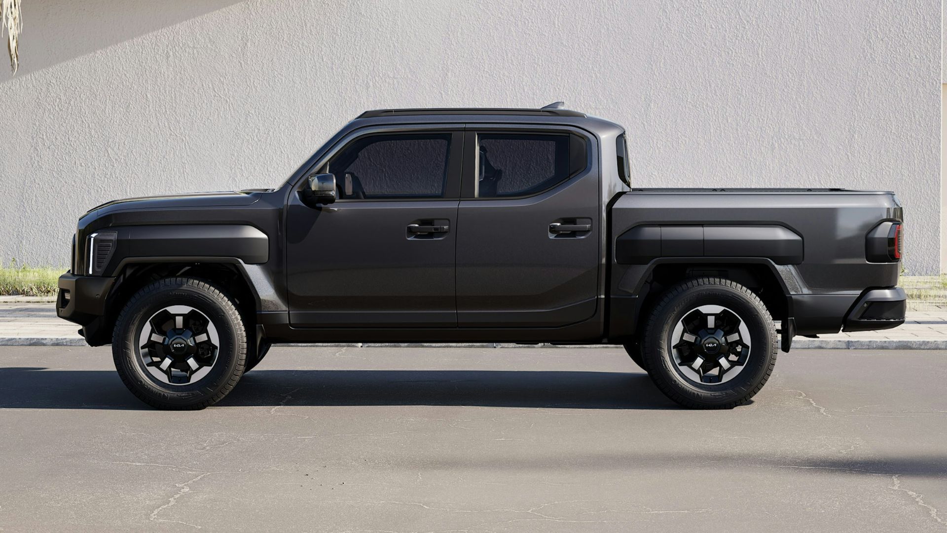 A black truck is parked in a parking lot